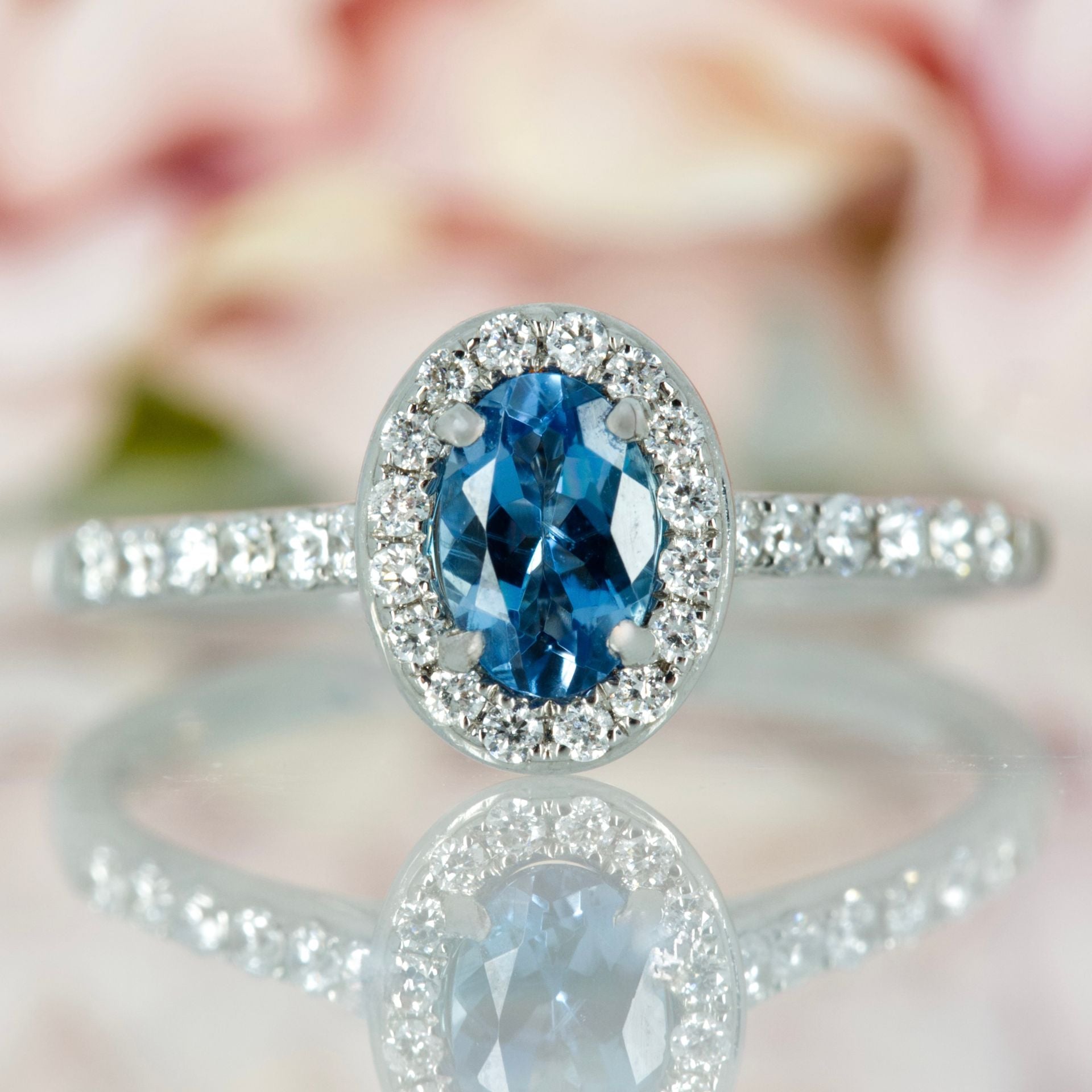 18ct White Gold Oval Cut Aquamarine & Round Brilliant Cut Diamond Halo Cluster Ring