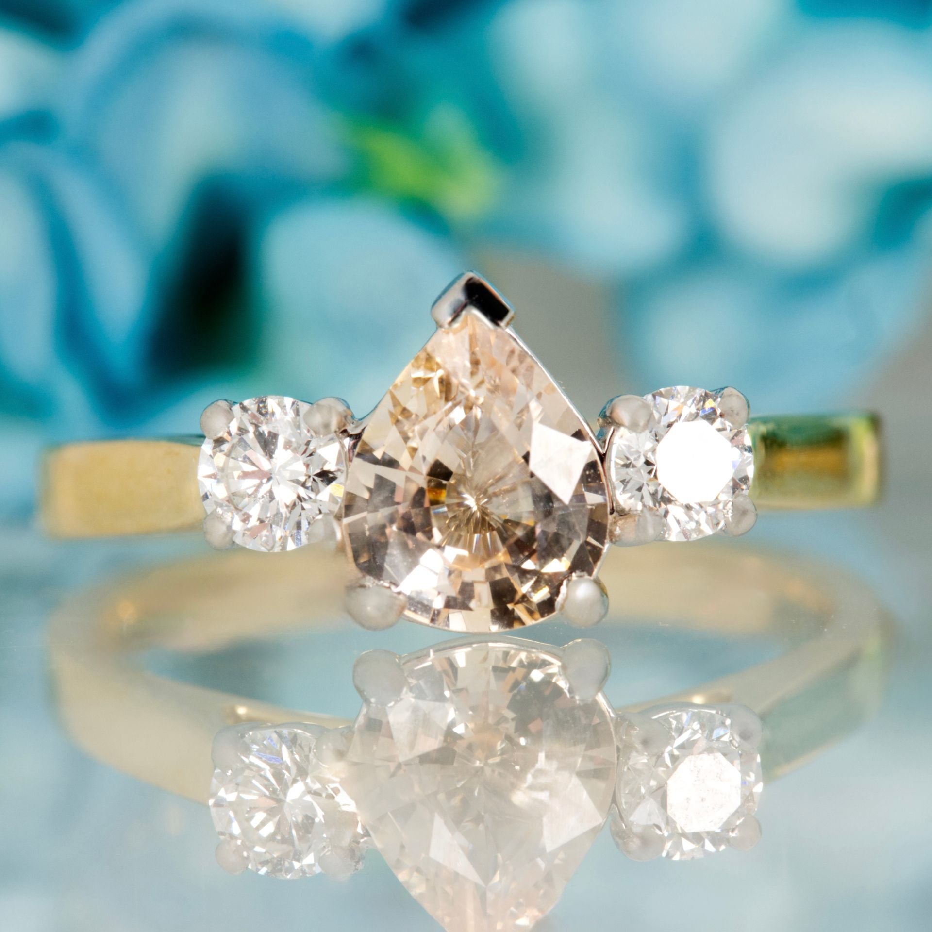 18ct Yellow Gold Pear Cut Blush Sapphire & Round Brilliant Cut Diamond Trilogy Ring