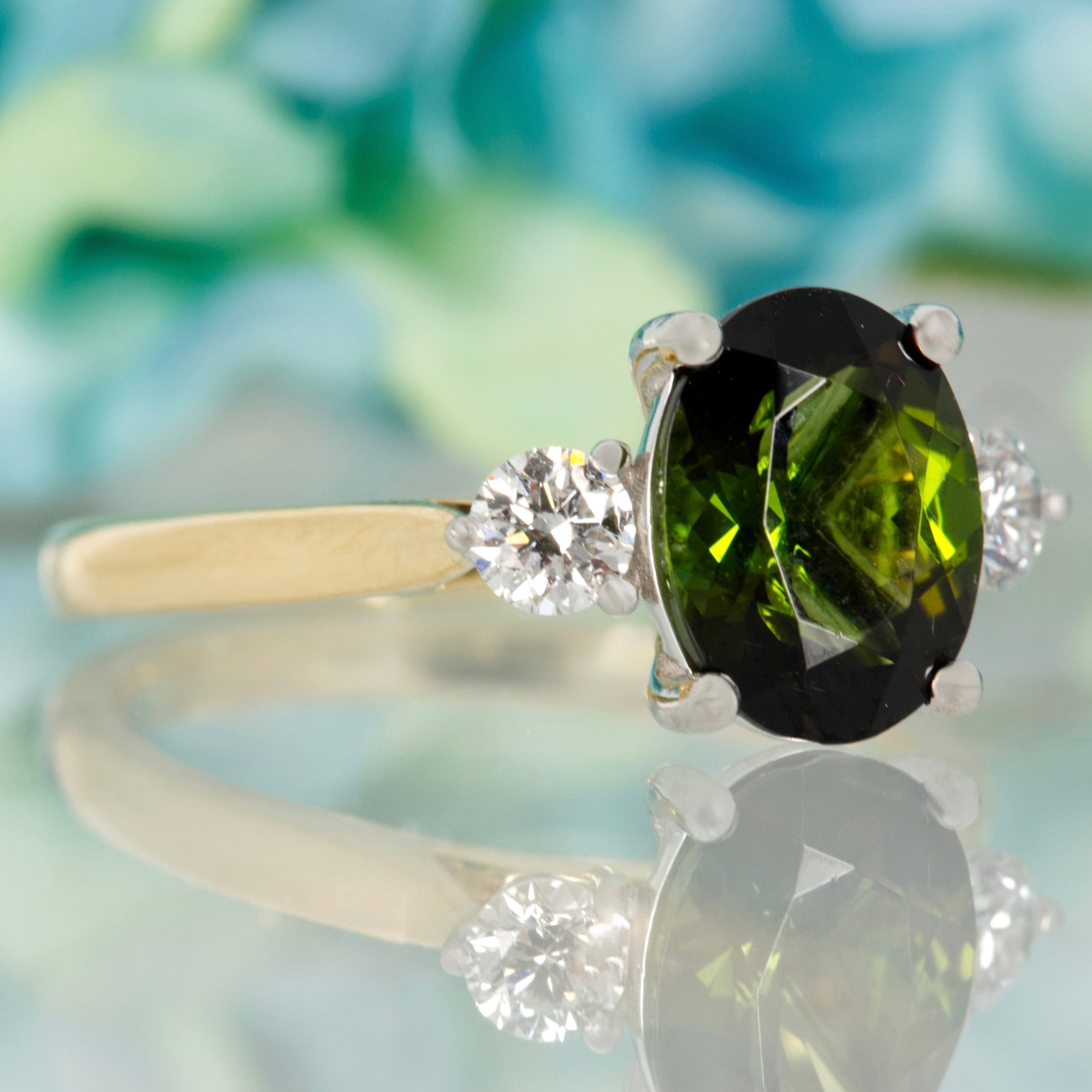 18ct Yellow Gold & Platinum Oval Cut Green Tourmaline & Round Brilliant Cut Diamond Trilogy Ring