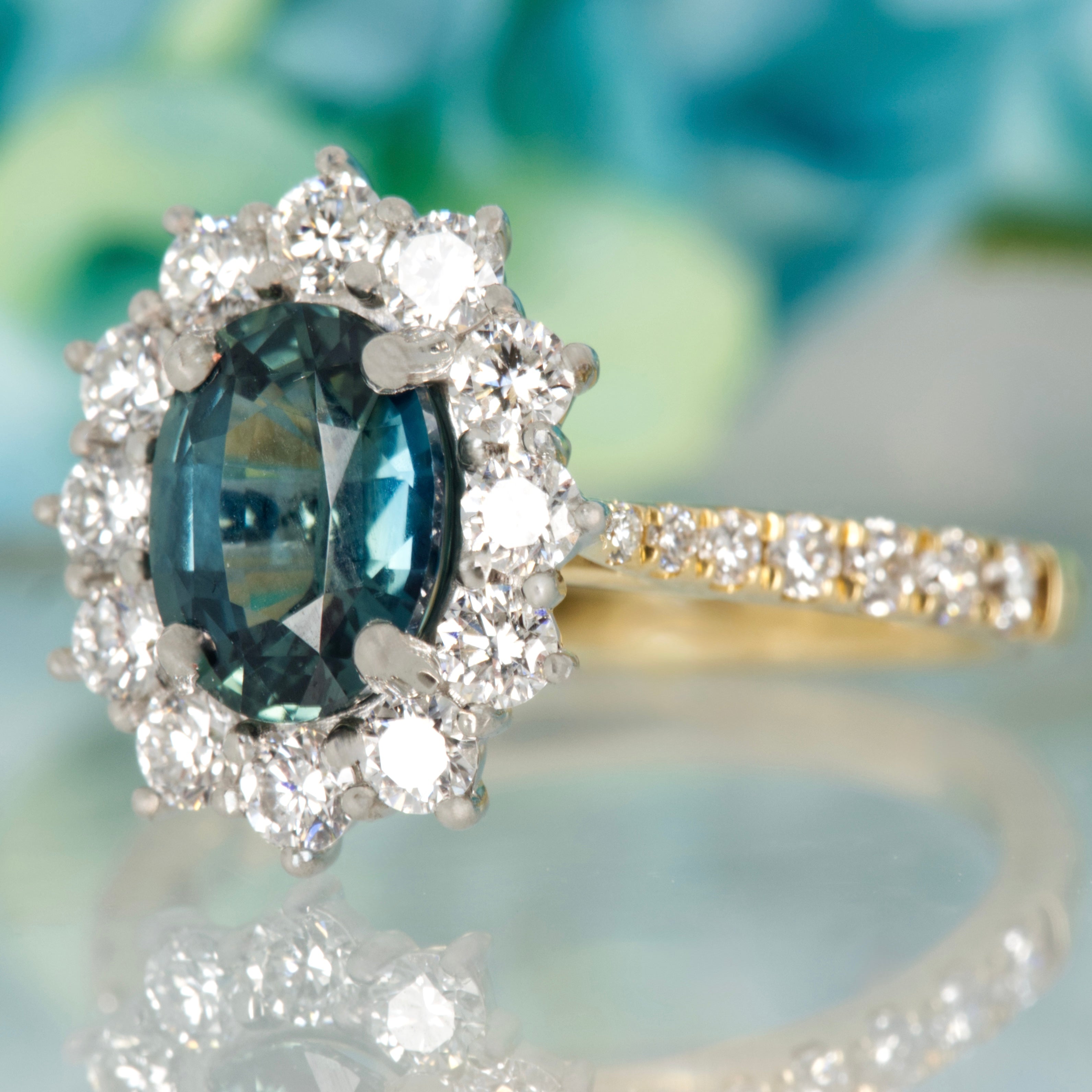 18ct Yellow Gold & Platinum Oval Cut Teal Sapphire & Round Brilliant Cut Diamond Cluster Ring