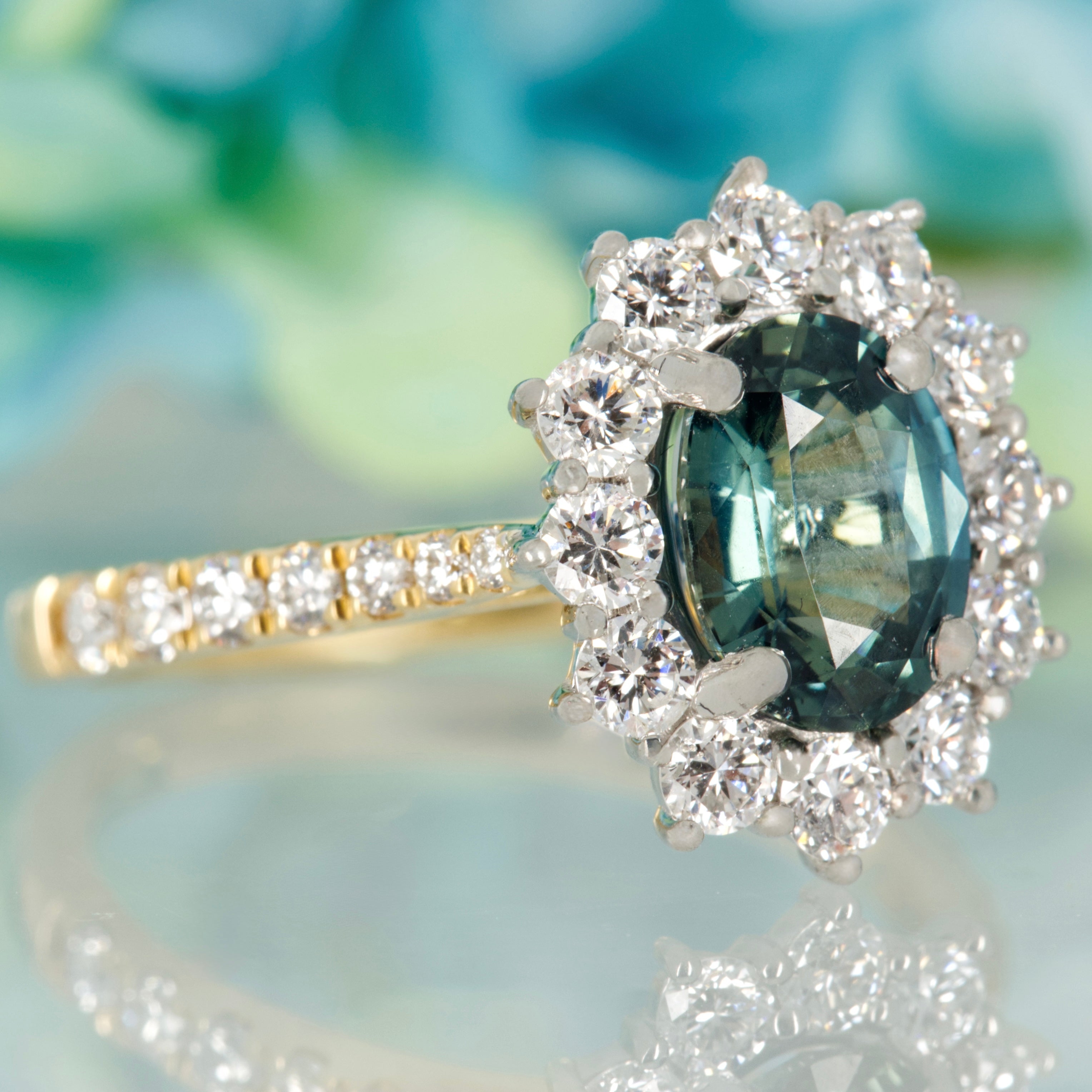 18ct Yellow Gold & Platinum Oval Cut Teal Sapphire & Round Brilliant Cut Diamond Cluster Ring