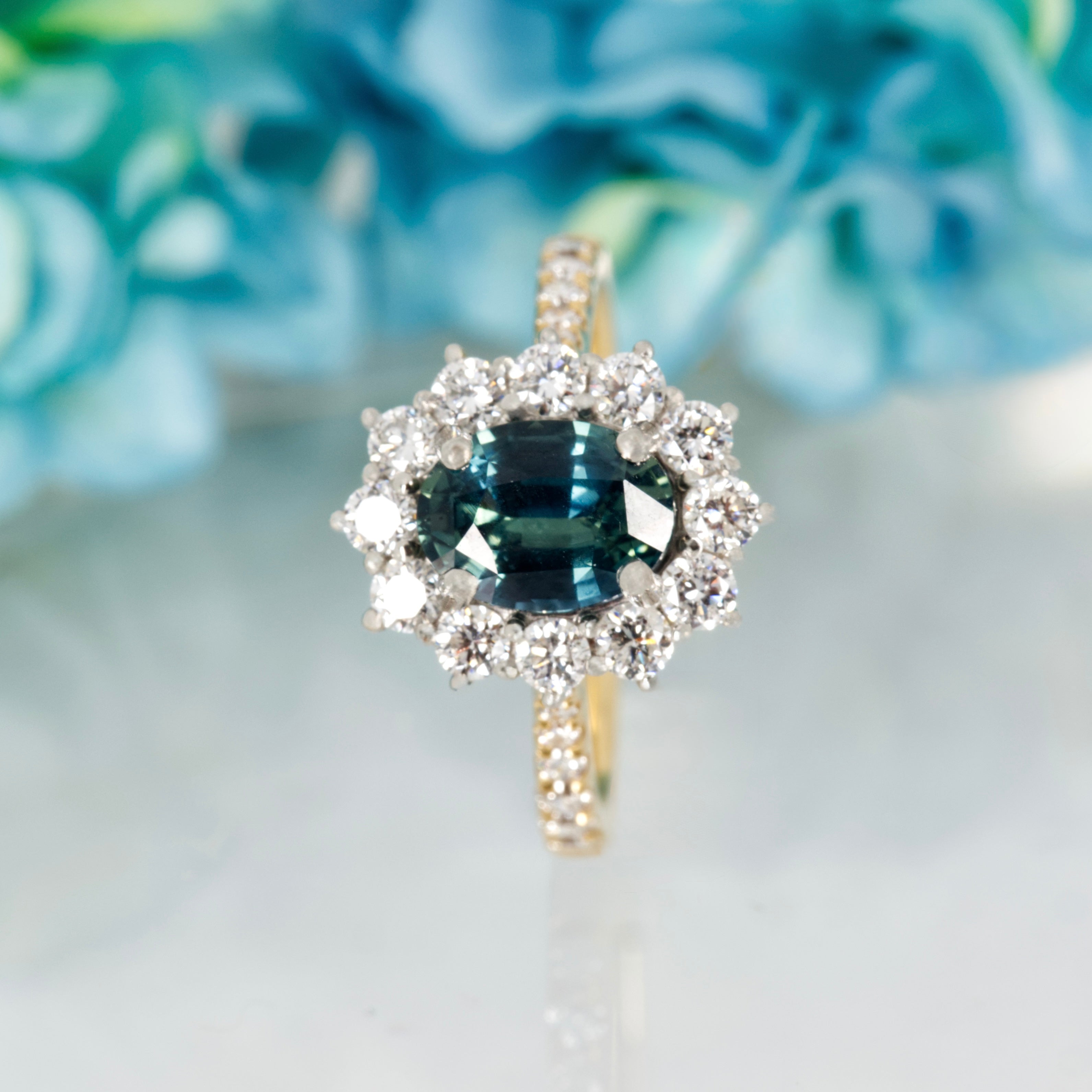 18ct Yellow Gold & Platinum Oval Cut Teal Sapphire & Round Brilliant Cut Diamond Cluster Ring