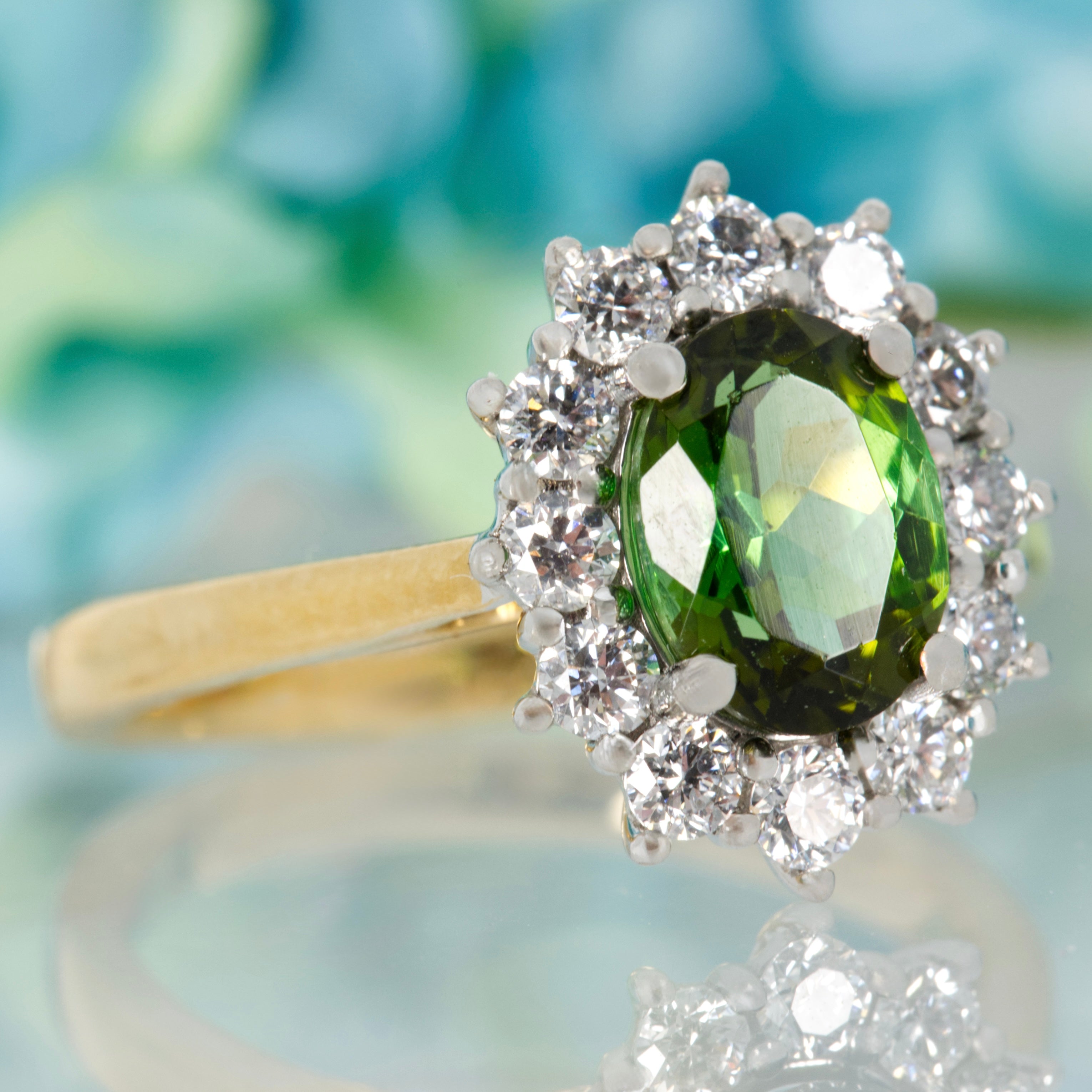 18ct Yellow Gold & Platinum Oval Cut Green Tourmaline & Round Brilliant Cut Diamond Cluster Ring