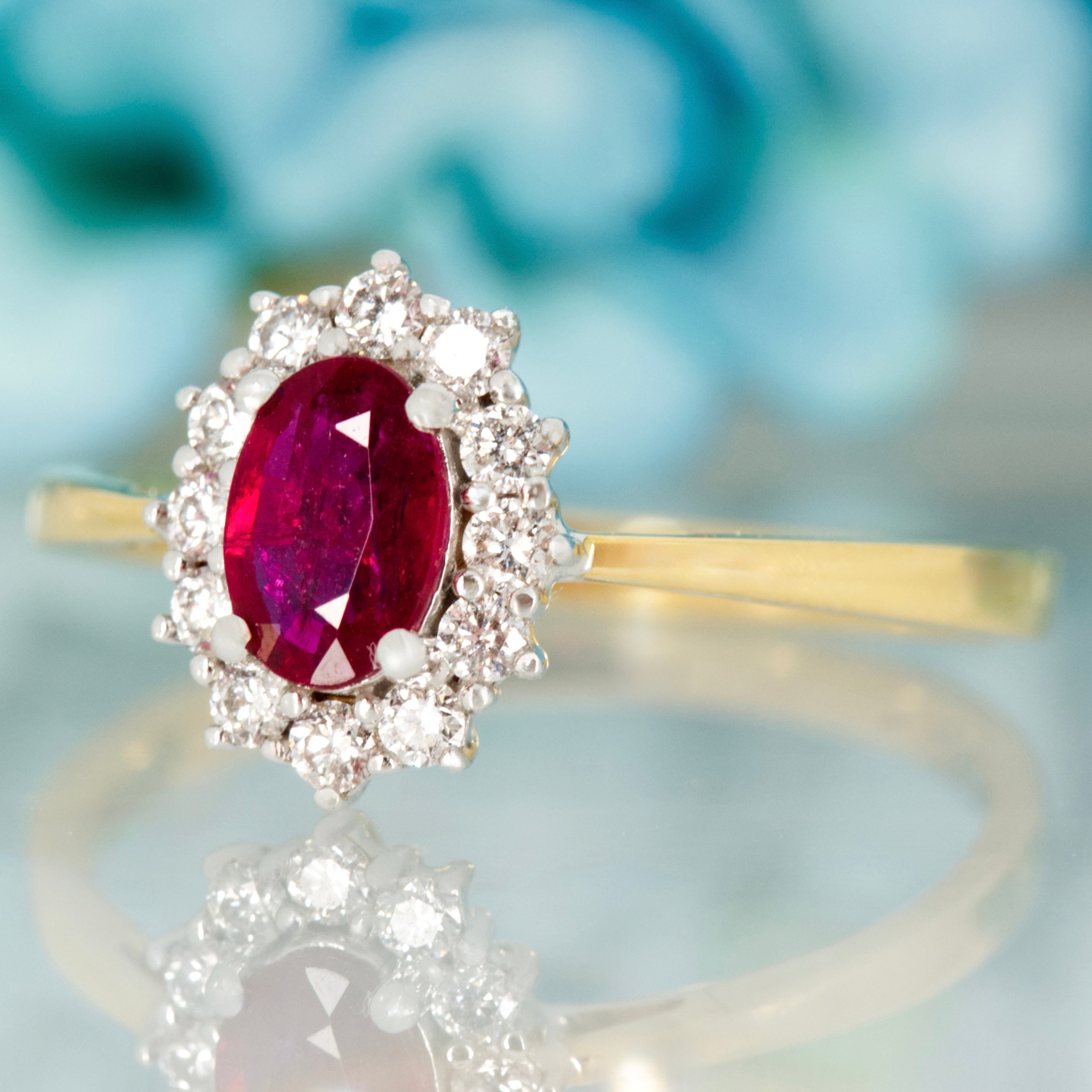 18ct Yellow Gold Oval Cut Ruby & Round Brilliant Cut Diamond Cluster Ring