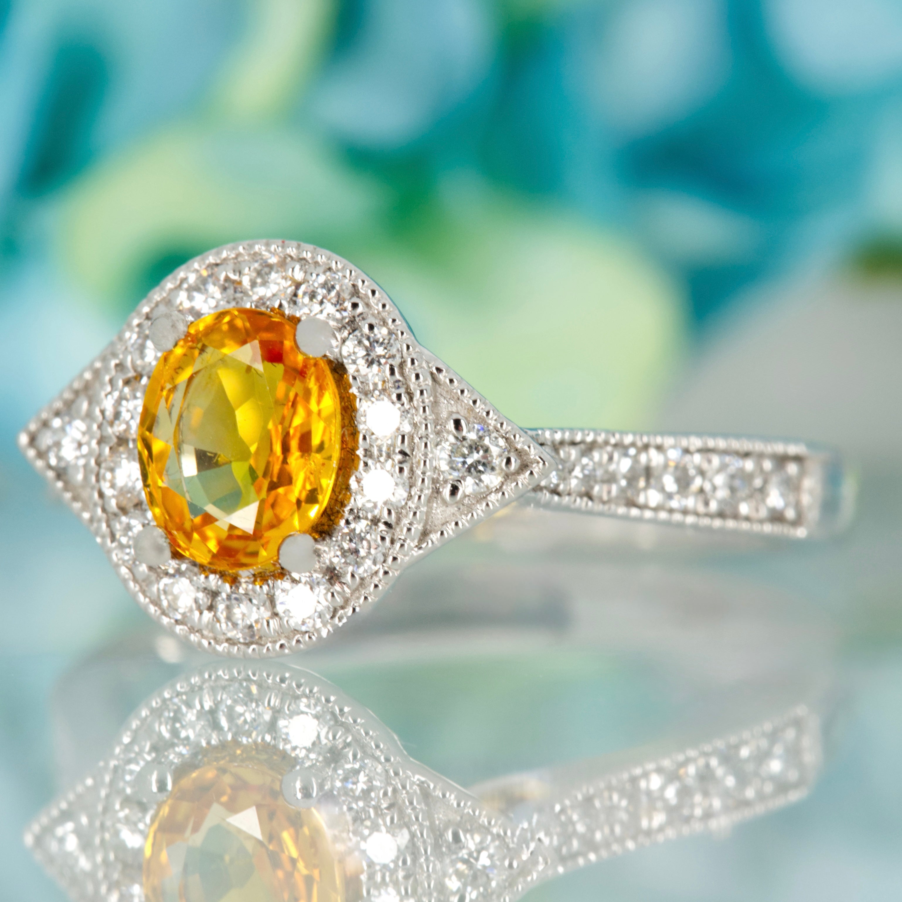 Platinum Oval Cut Yellow Sapphire & Round Brilliant Cut Diamond Halo Cluster Ring