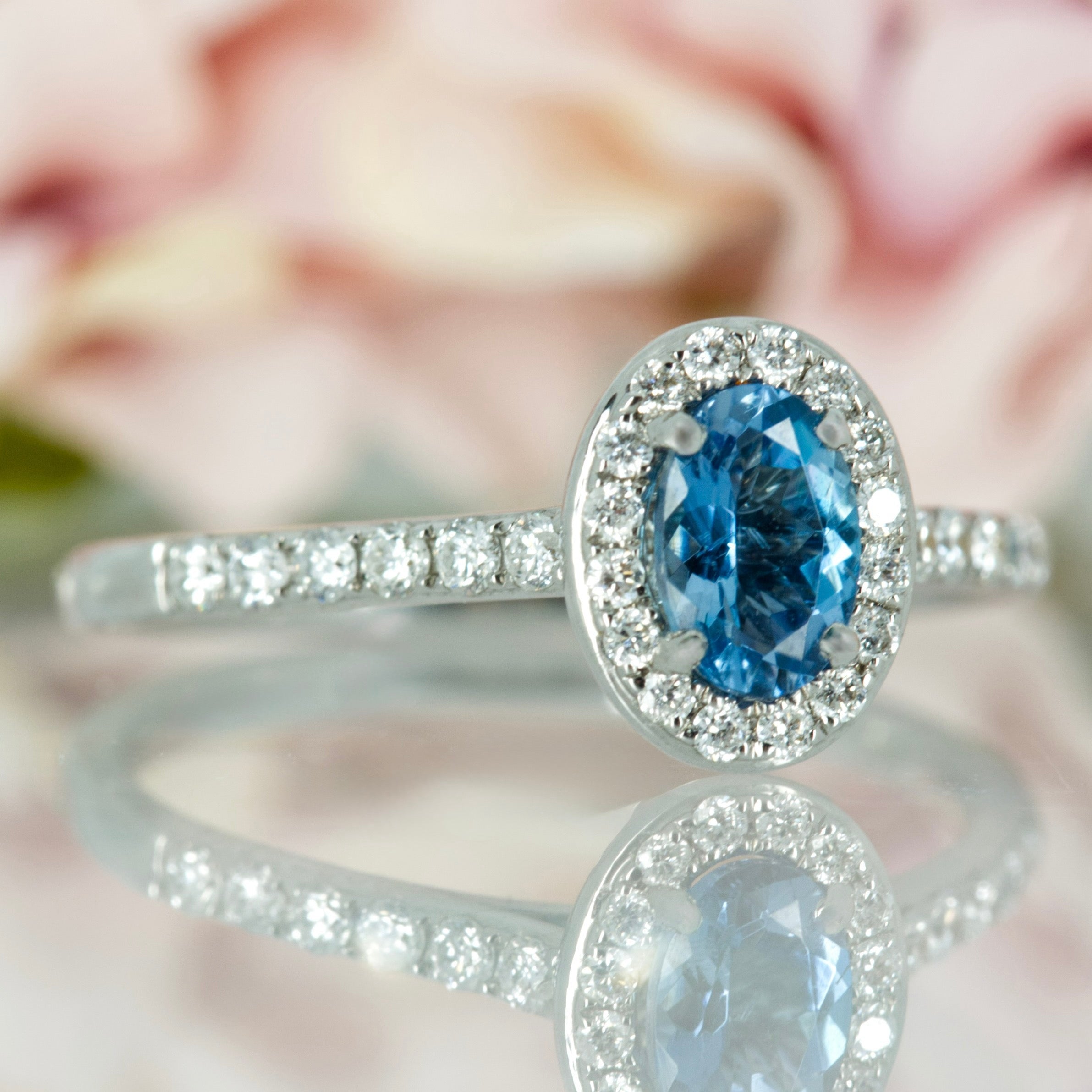 18ct White Gold Oval Cut Aquamarine & Round Brilliant Cut Diamond Halo Cluster Ring