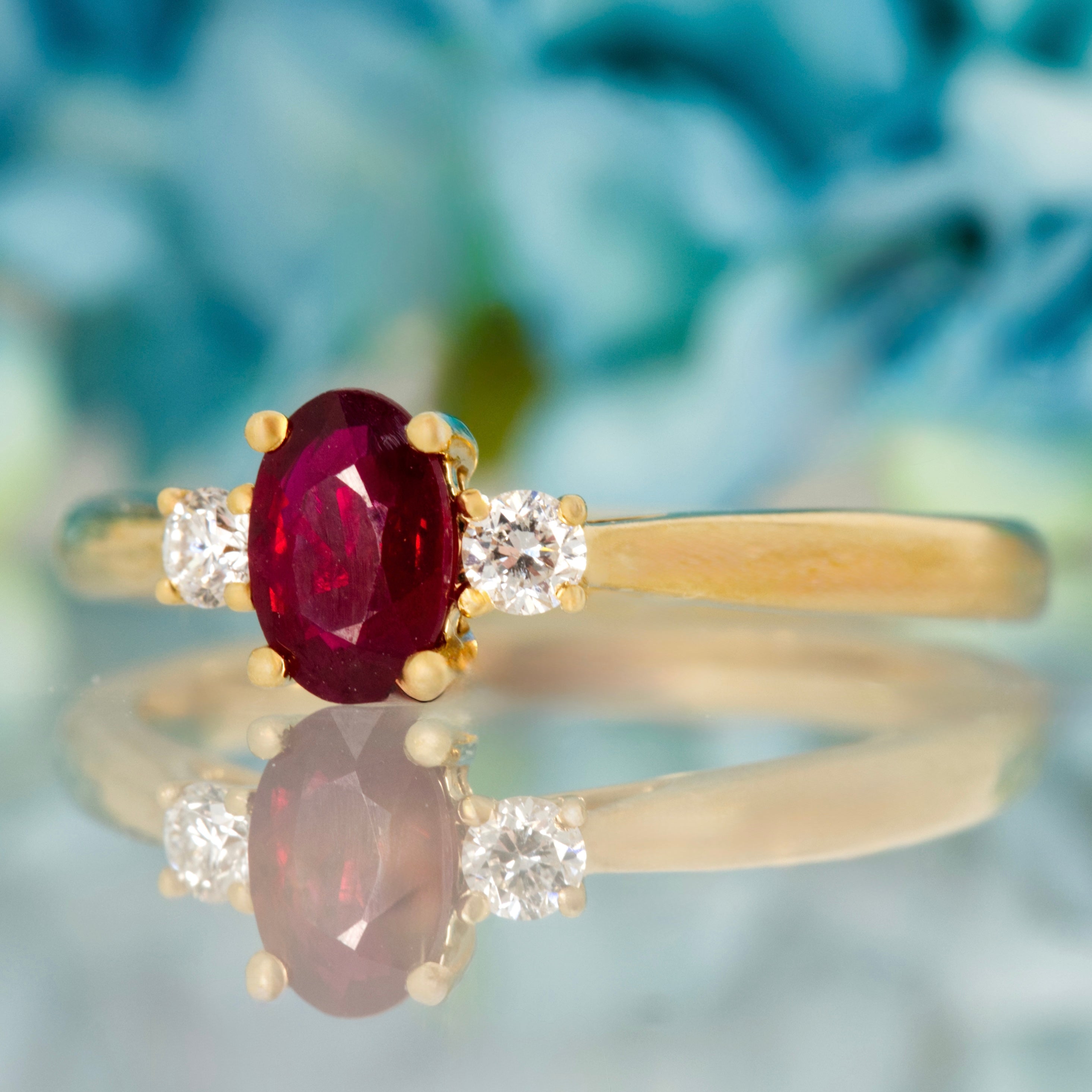 18ct Yellow Gold Oval Cut Ruby & Round Brilliant Cut Diamond Trilogy Ring