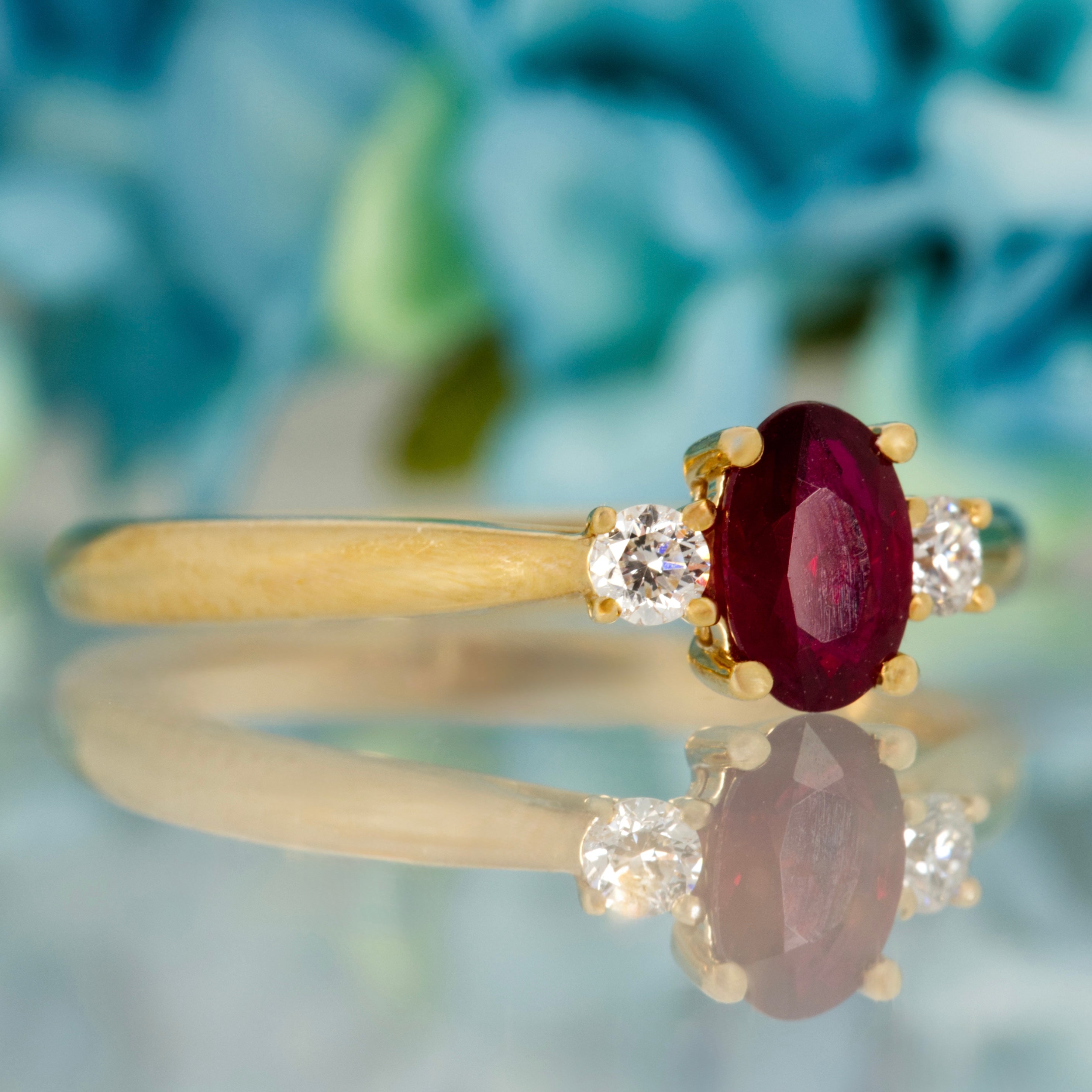 18ct Yellow Gold Oval Cut Ruby & Round Brilliant Cut Diamond Trilogy Ring