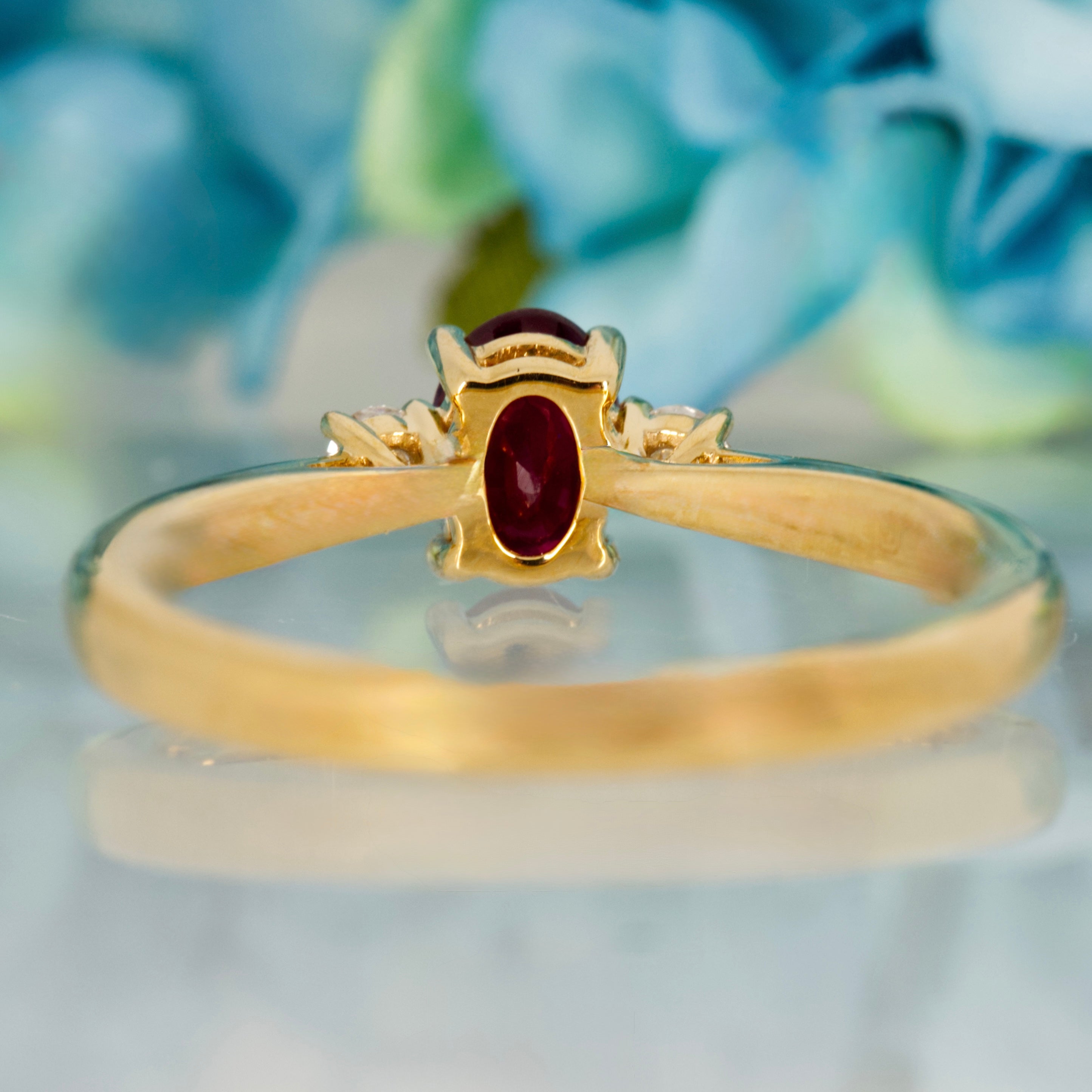 18ct Yellow Gold Oval Cut Ruby & Round Brilliant Cut Diamond Trilogy Ring