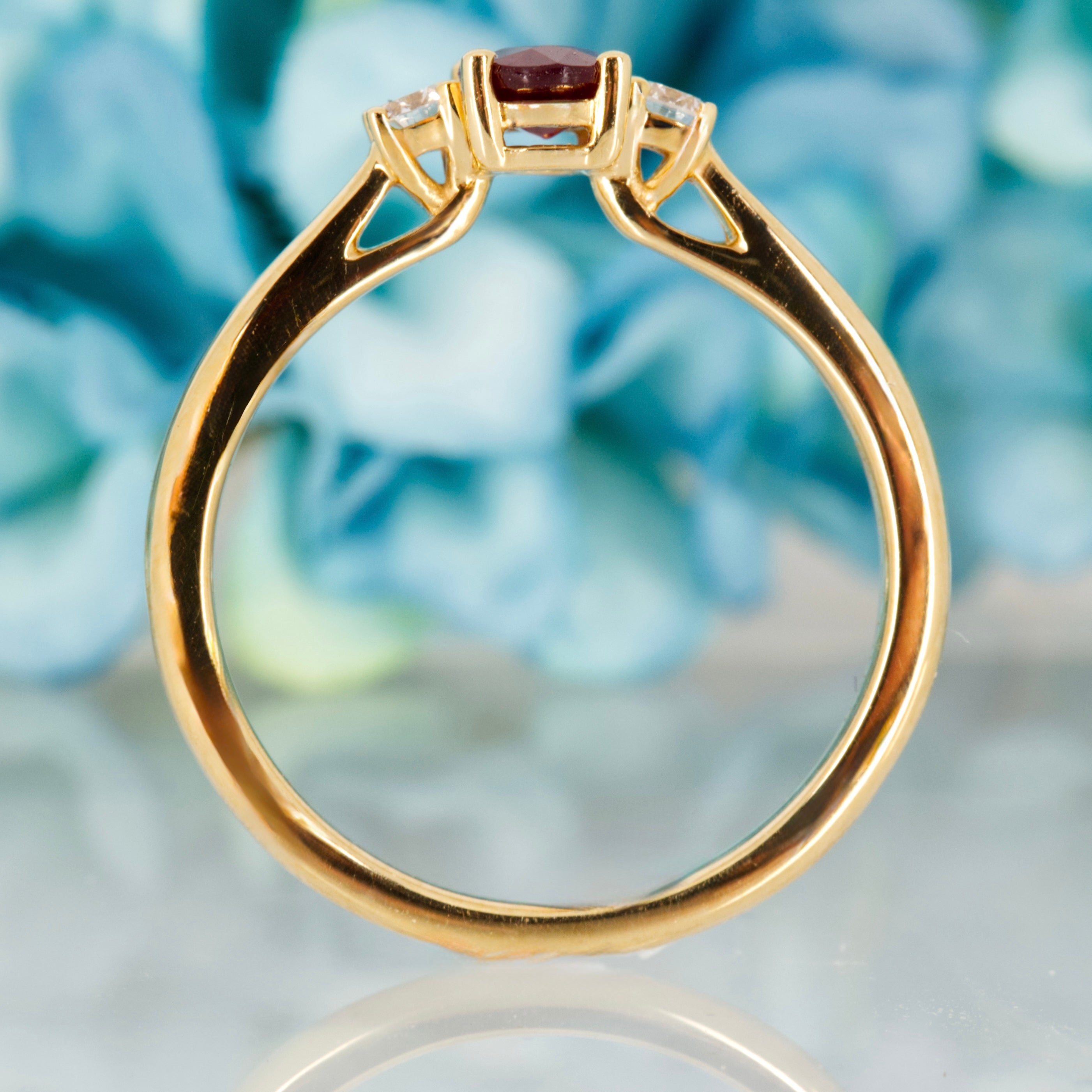 18ct Yellow Gold Oval Cut Ruby & Round Brilliant Cut Diamond Trilogy Ring