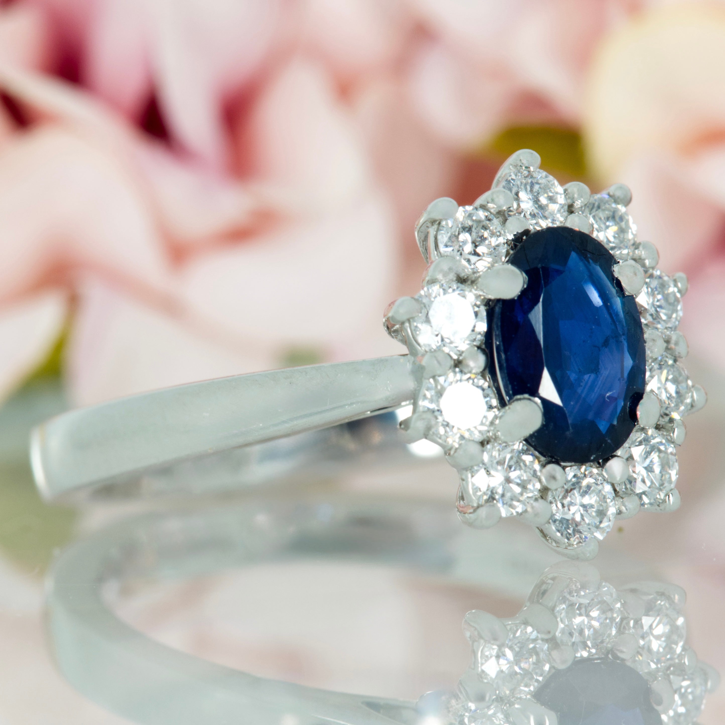 Platinum Oval Cut Sapphire & Round Brilliant Cut Diamond Cluster Ring