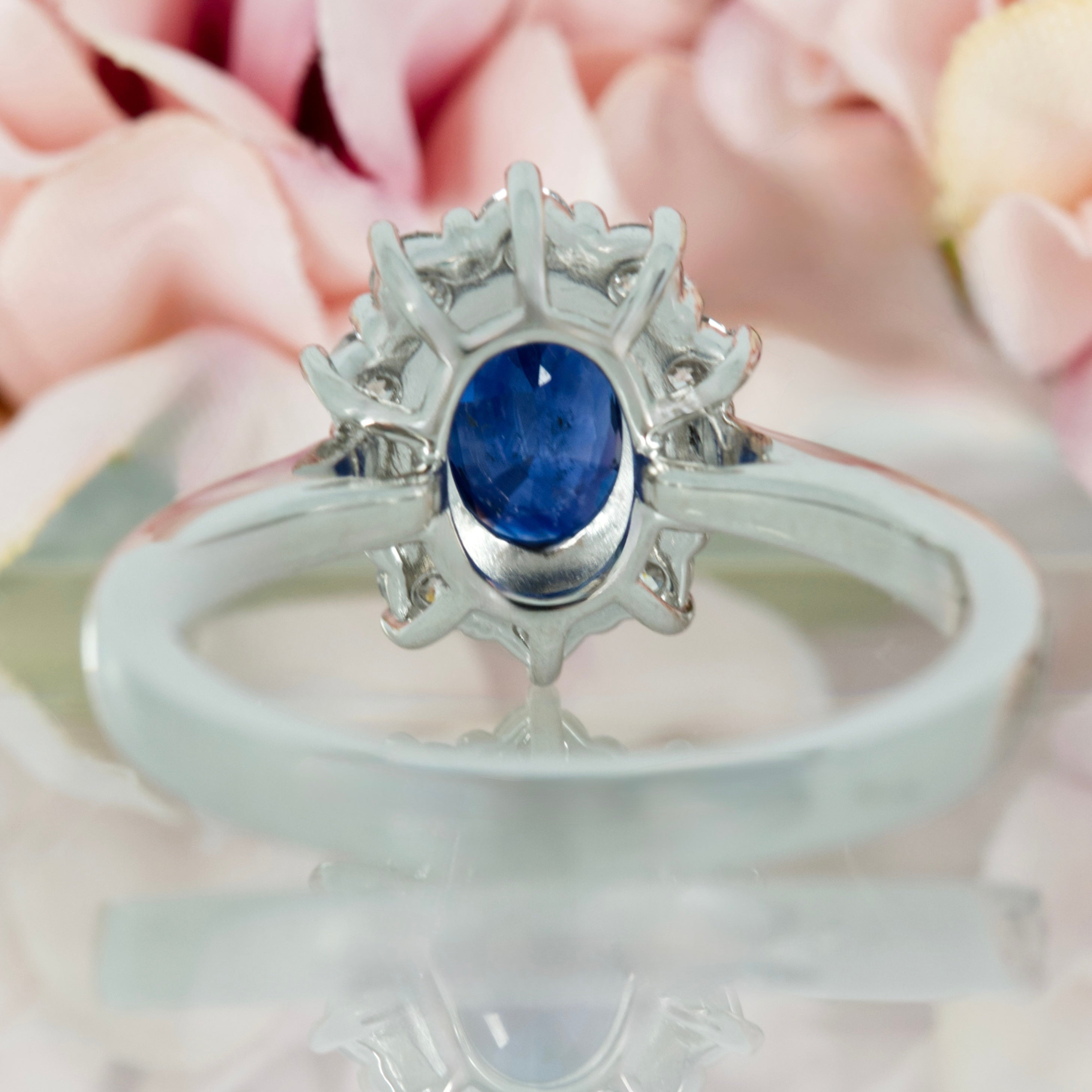 Platinum Oval Cut Sapphire & Round Brilliant Cut Diamond Cluster Ring
