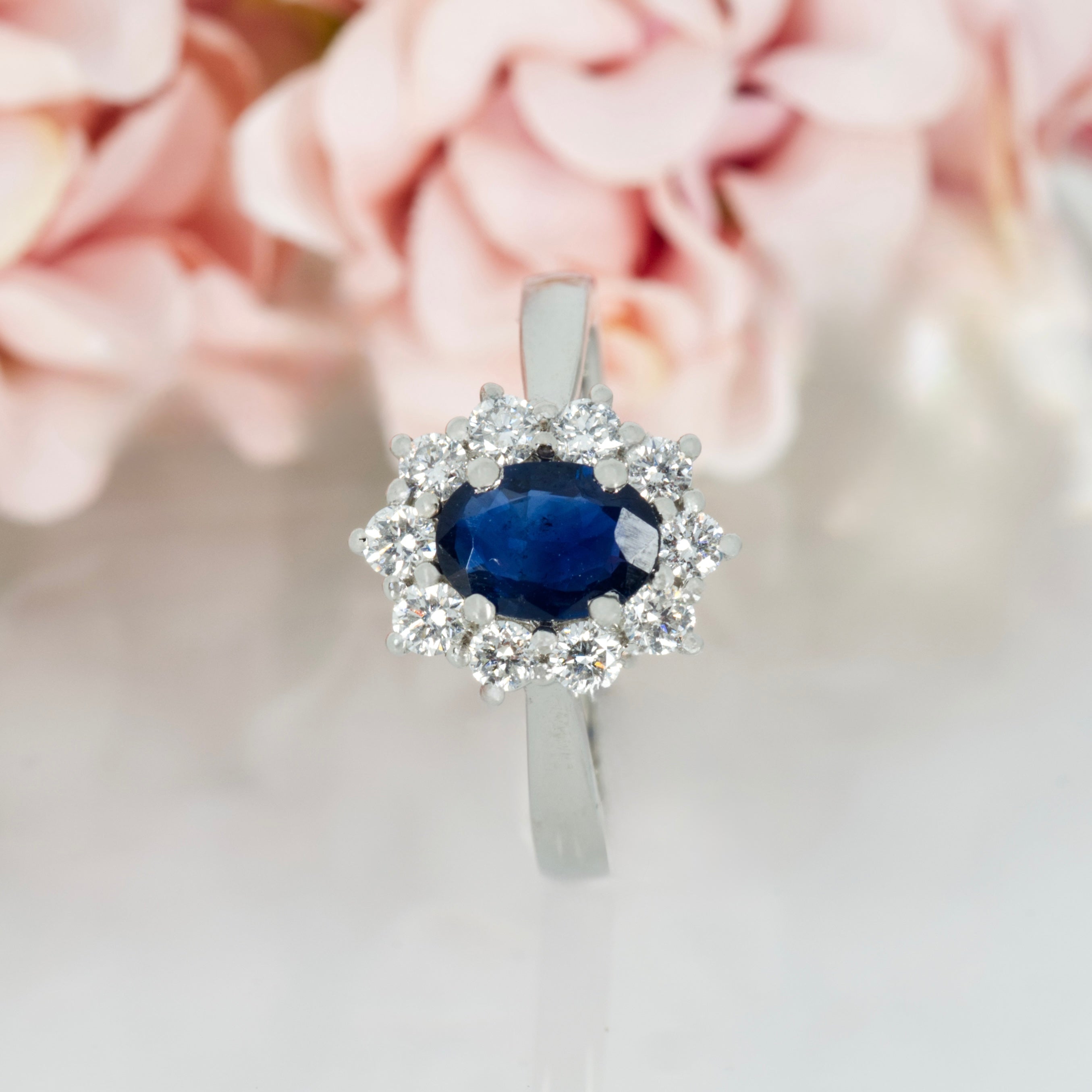 Platinum Oval Cut Sapphire & Round Brilliant Cut Diamond Cluster Ring