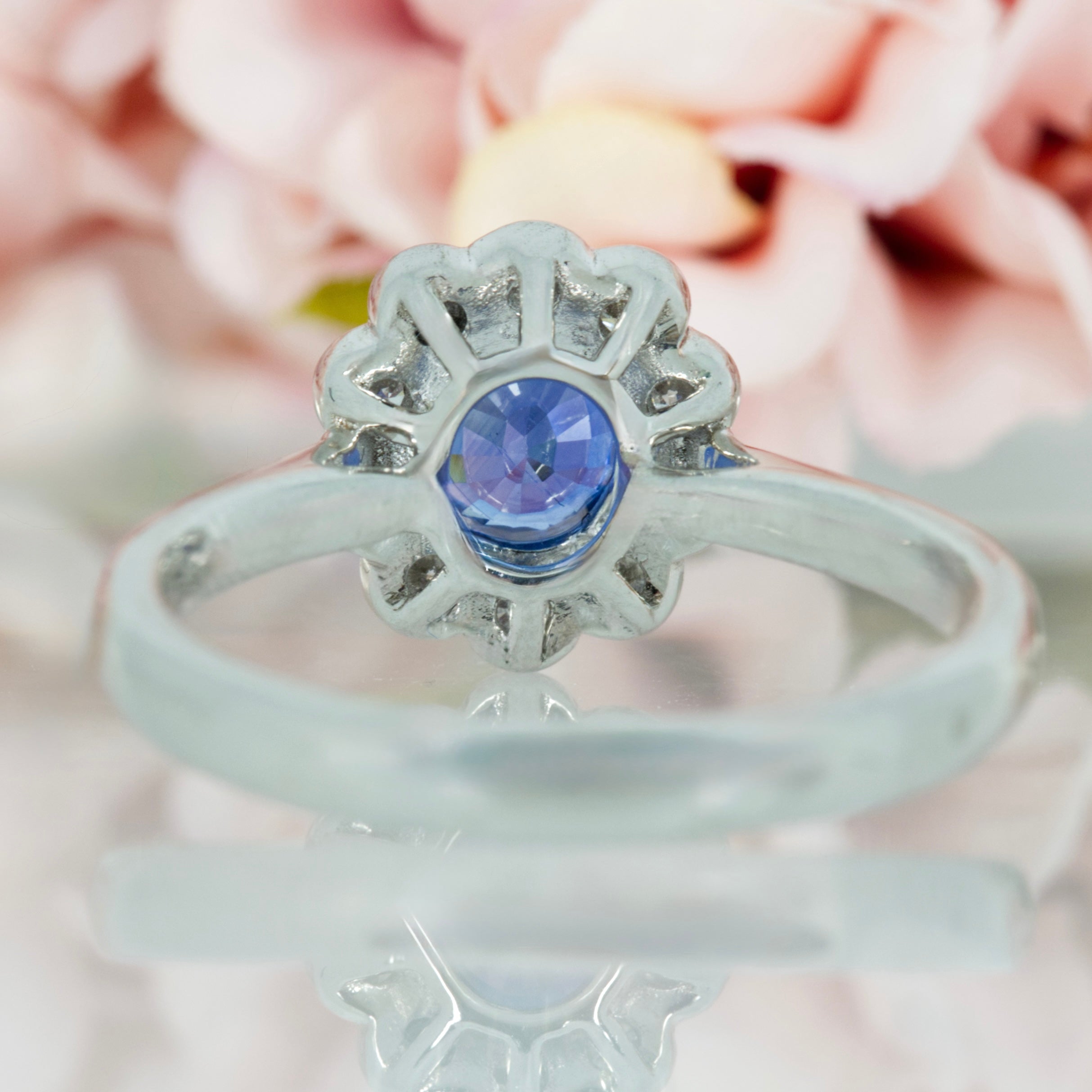 Platinum Oval Cut Sapphire & Round Brilliant Cut Diamond Cluster Ring