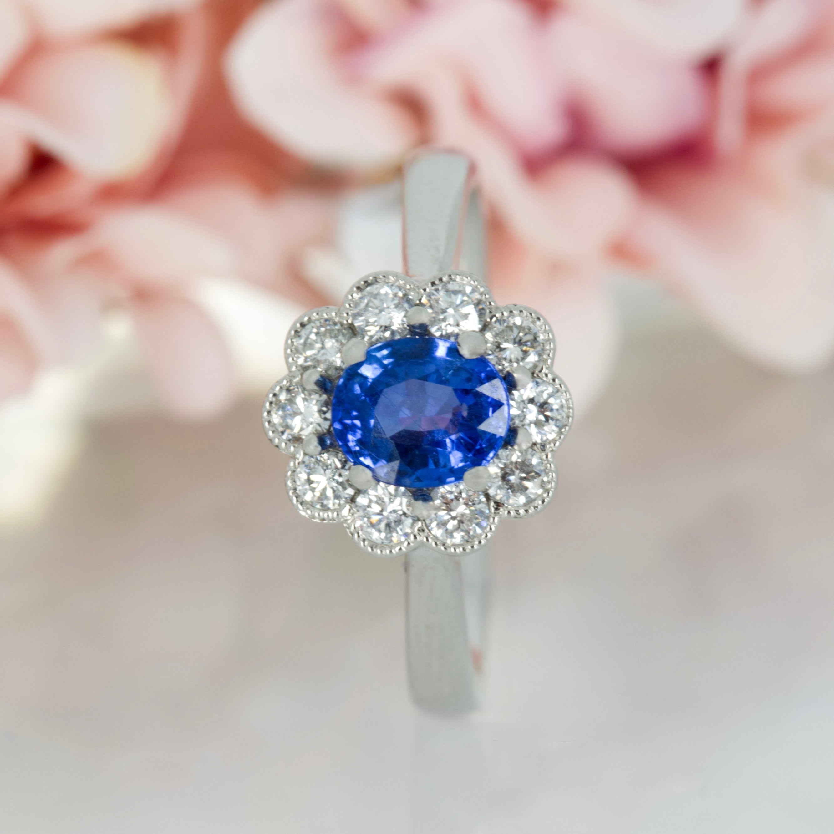 Platinum Oval Cut Sapphire & Round Brilliant Cut Diamond Cluster Ring