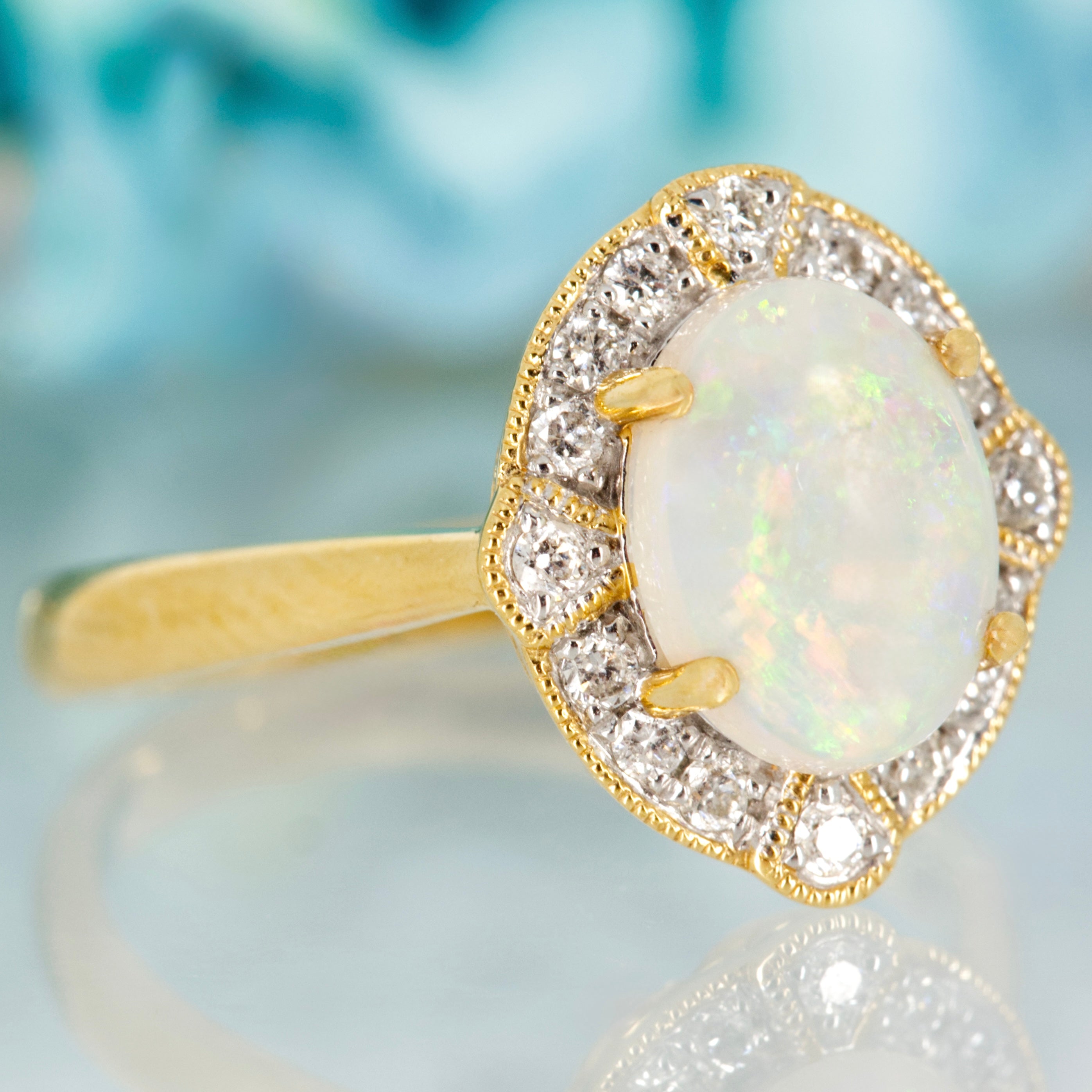 18ct Yellow Gold Oval Shaped Opal & Round Brilliant Cut Diamond Cluster Ring