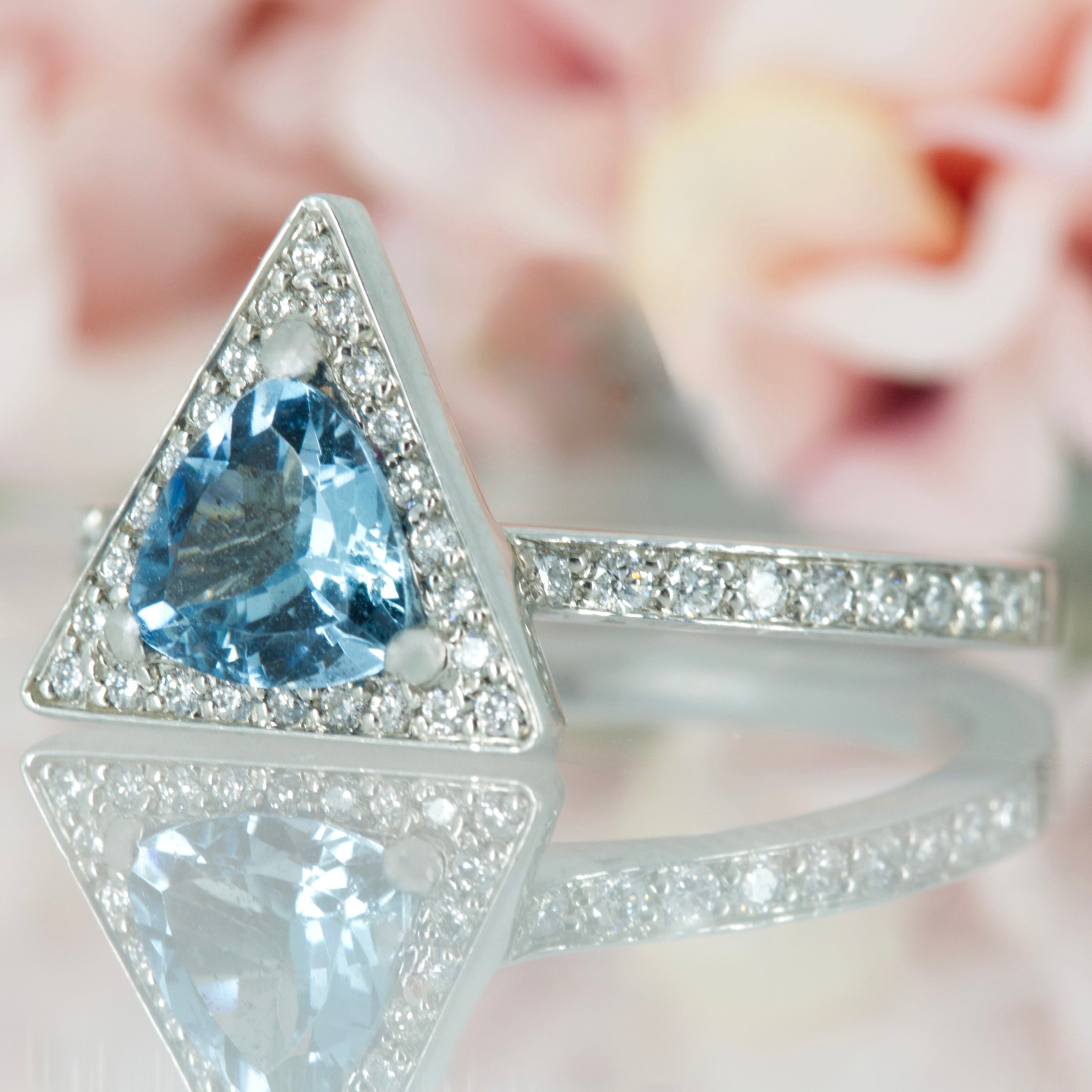 Platinum Trilliant Cut Aquamarine & Round Brilliant Cut Diamond Halo Cluster Ring