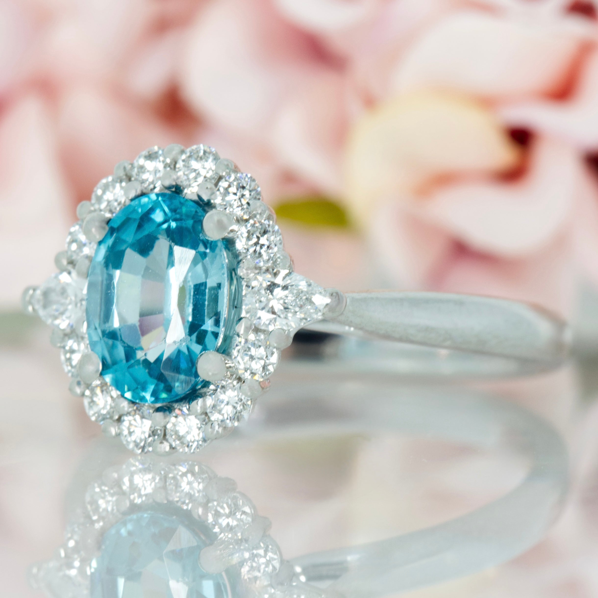 Platinum Oval Cut Blue Zircon & Pear and Round Brilliant Cut Diamond Cluster Ring