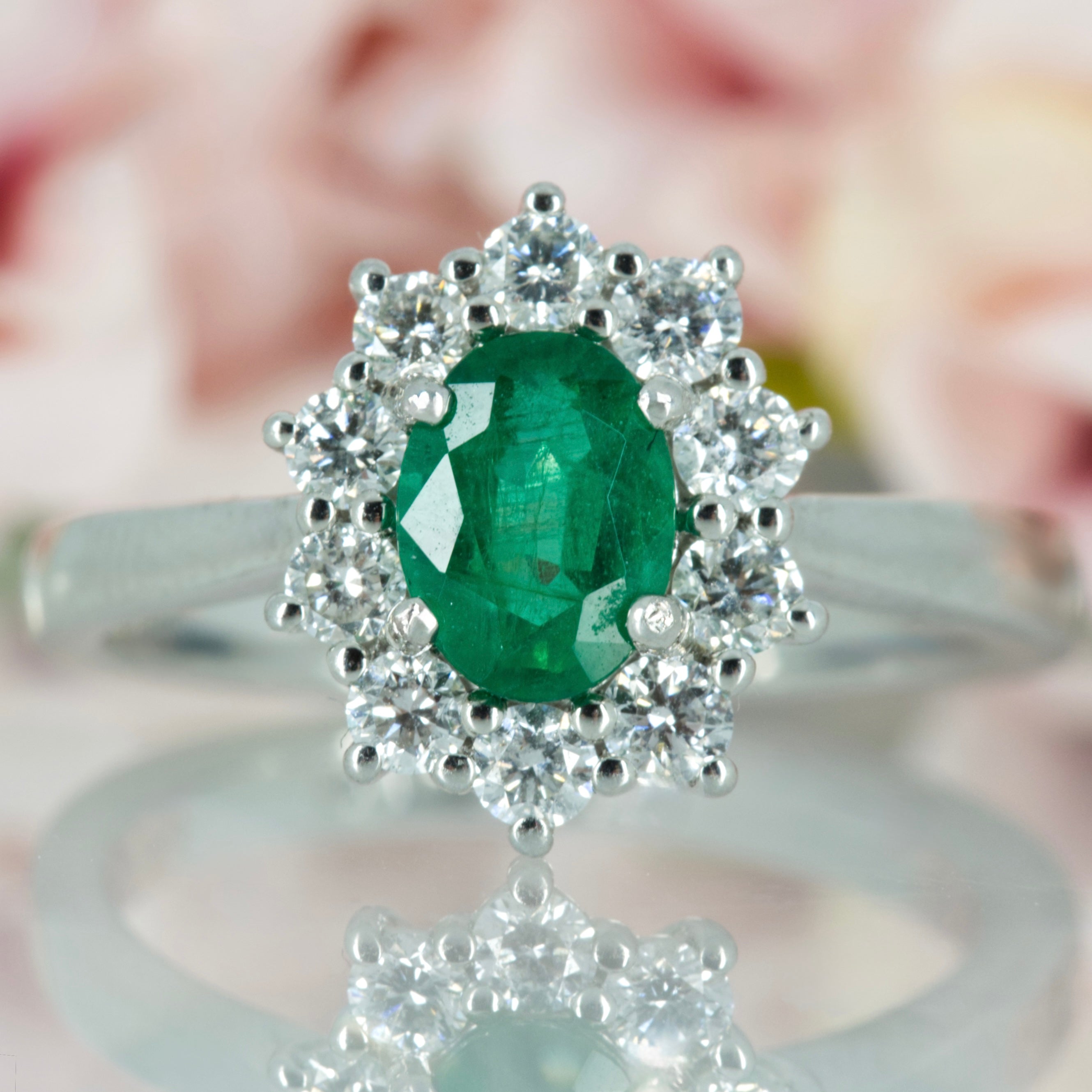 Platinum Oval Cut Emerald & Round Brilliant Cut Diamond Cluster Ring