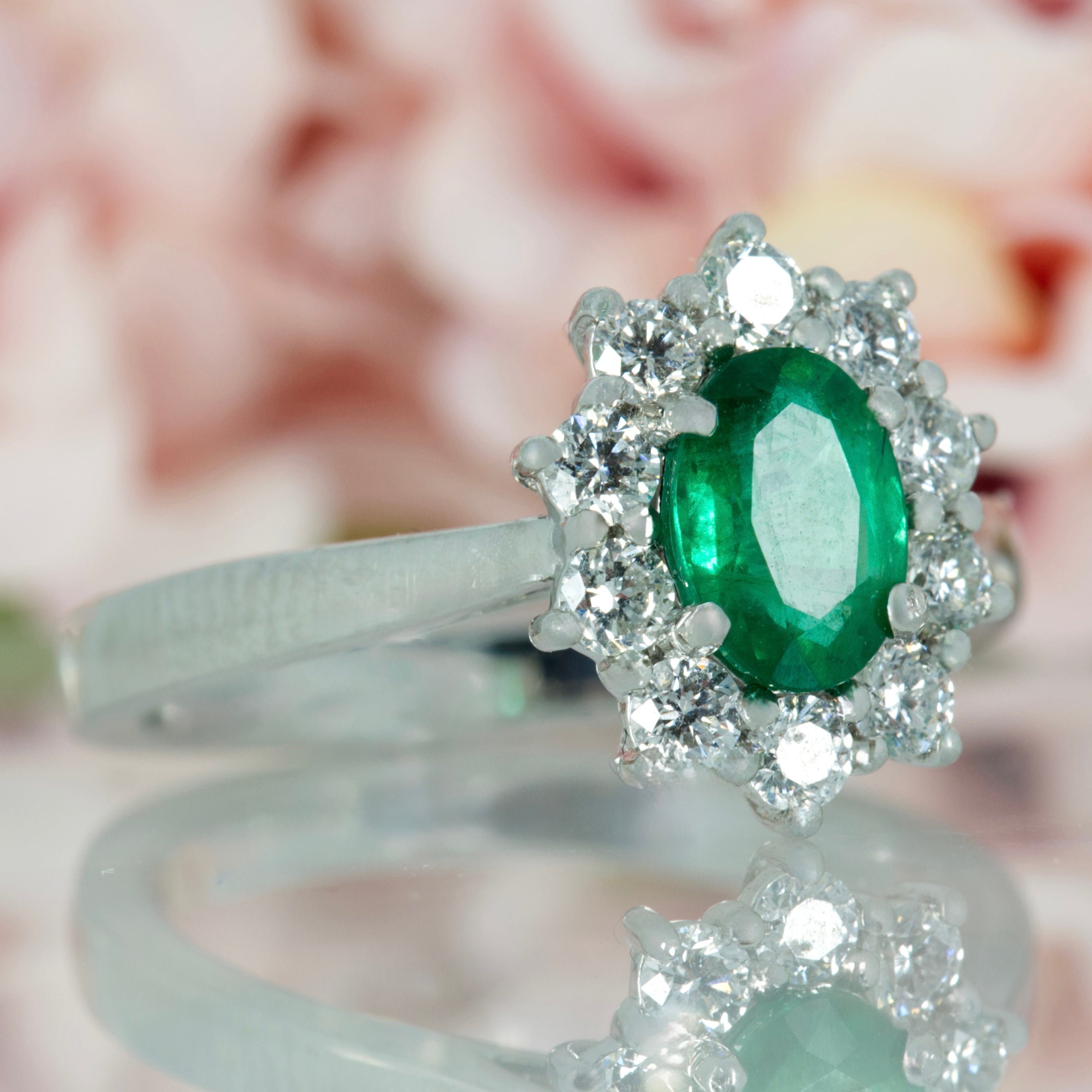 Platinum Oval Cut Emerald & Round Brilliant Cut Diamond Cluster Ring