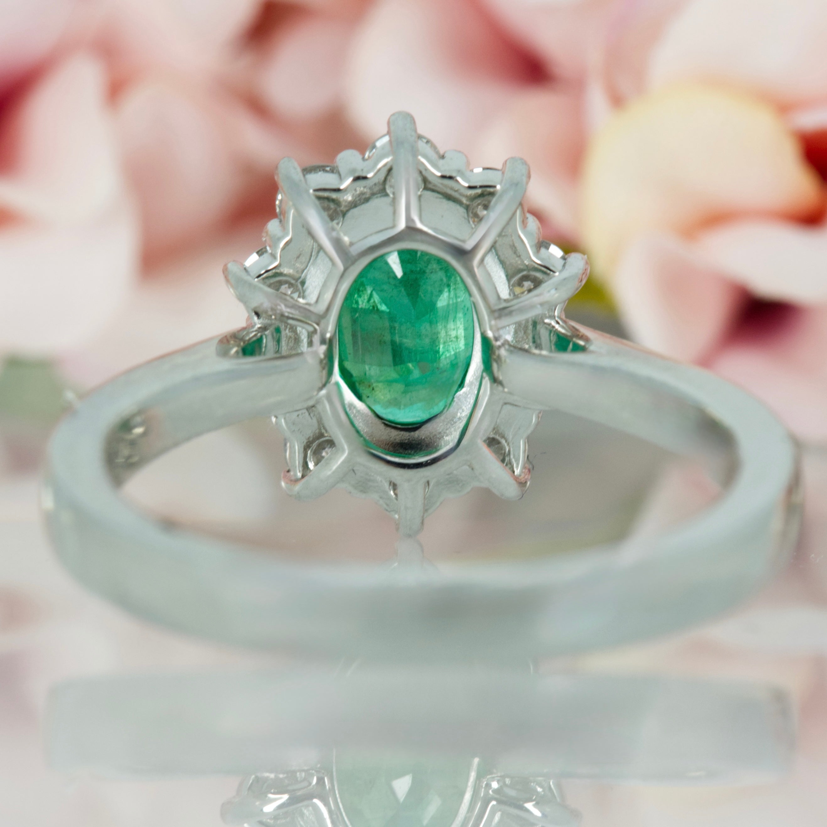 Platinum Oval Cut Emerald & Round Brilliant Cut Diamond Cluster Ring