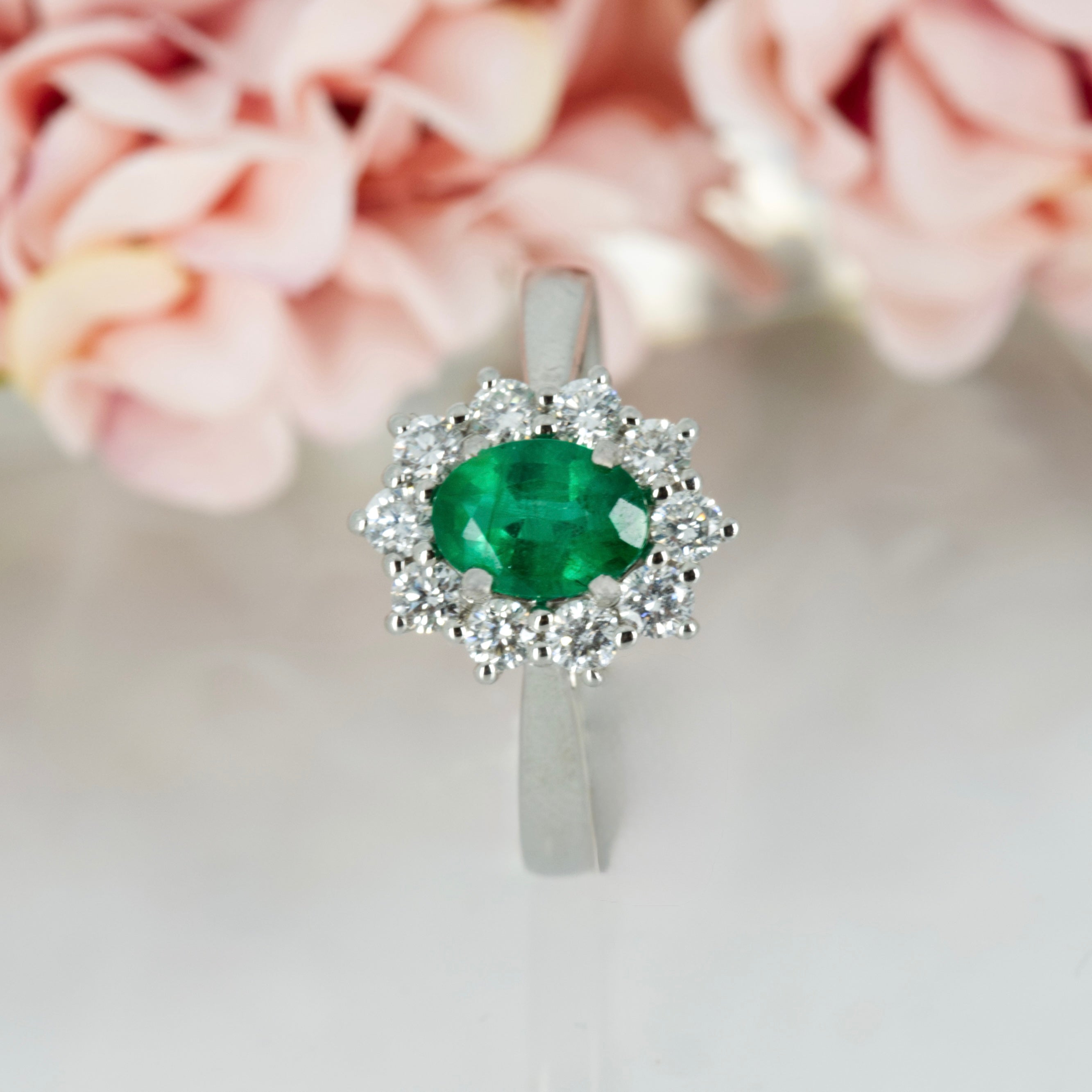 Platinum Oval Cut Emerald & Round Brilliant Cut Diamond Cluster Ring