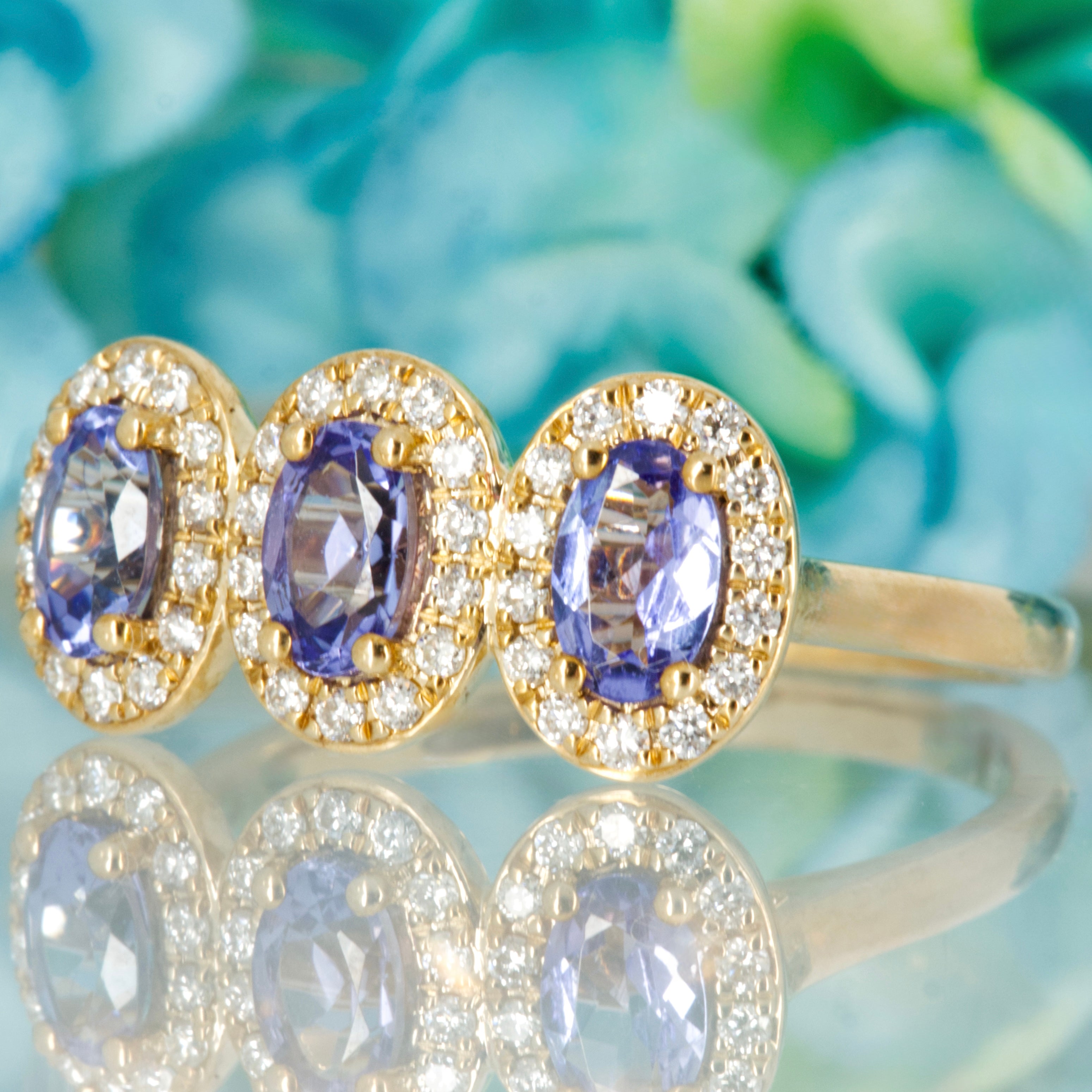9ct Yellow Gold Oval Cut Tanzanite & Round Brilliant Cut Diamond Triple Halo Cluster Ring