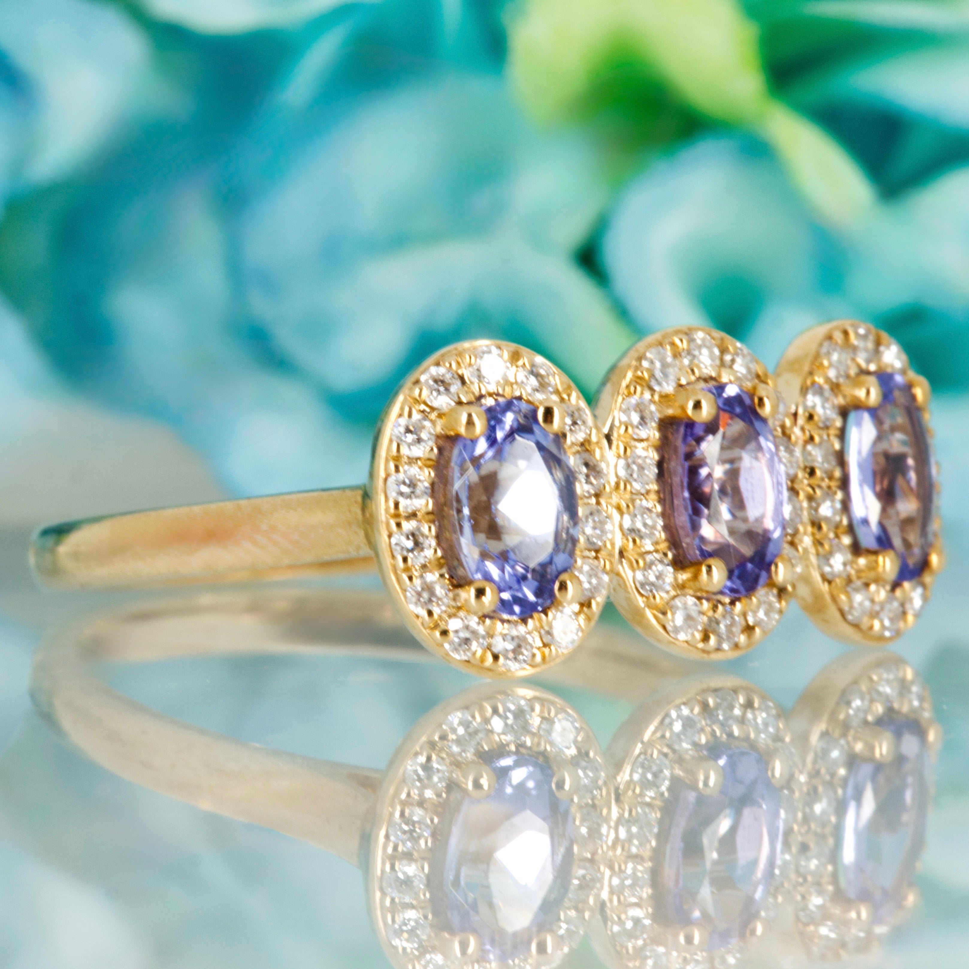 9ct Yellow Gold Oval Cut Tanzanite & Round Brilliant Cut Diamond Triple Halo Cluster Ring