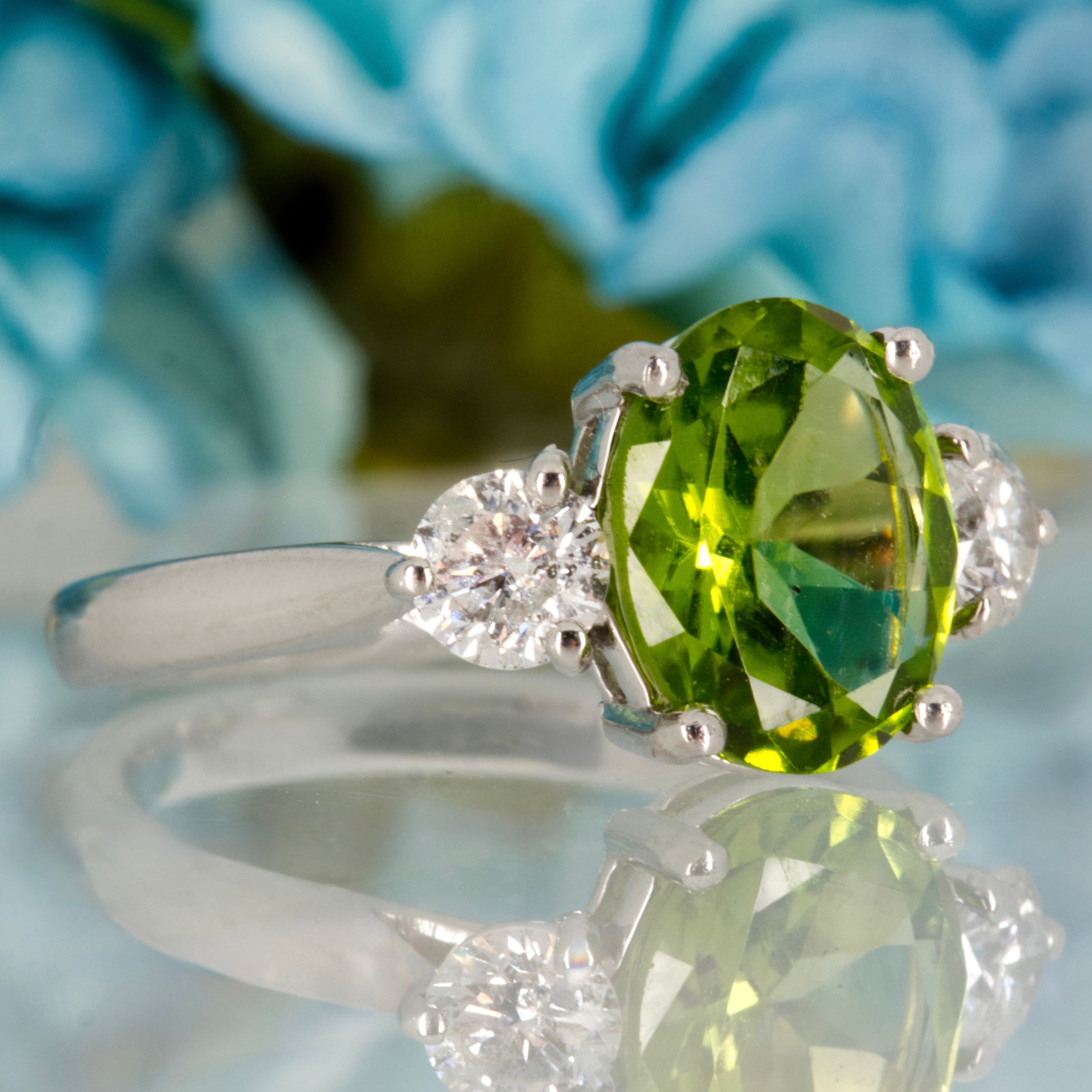 Platinum Oval Cut Peridot & Round Brilliant Cut Diamond Trilogy Ring