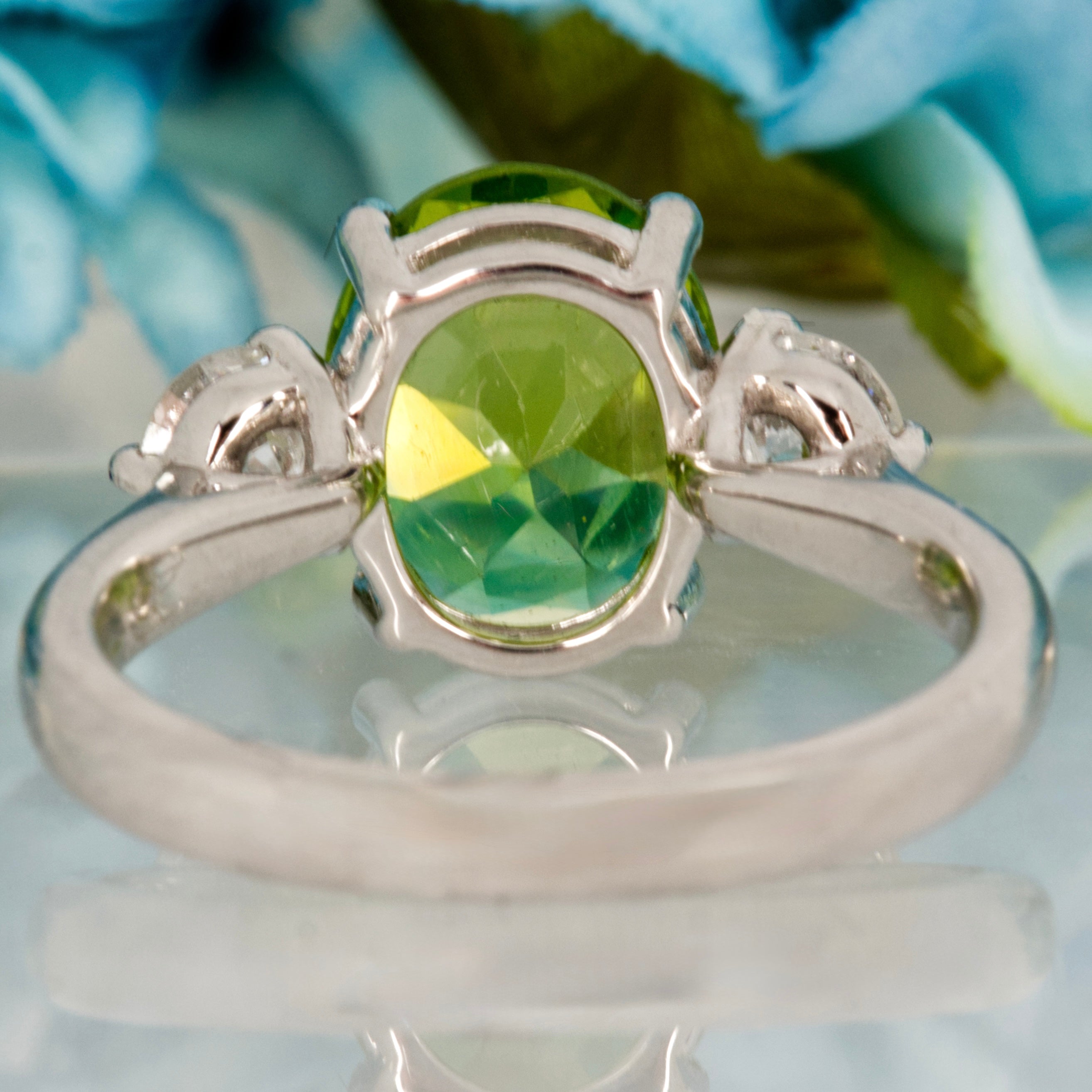 Platinum Oval Cut Peridot & Round Brilliant Cut Diamond Trilogy Ring