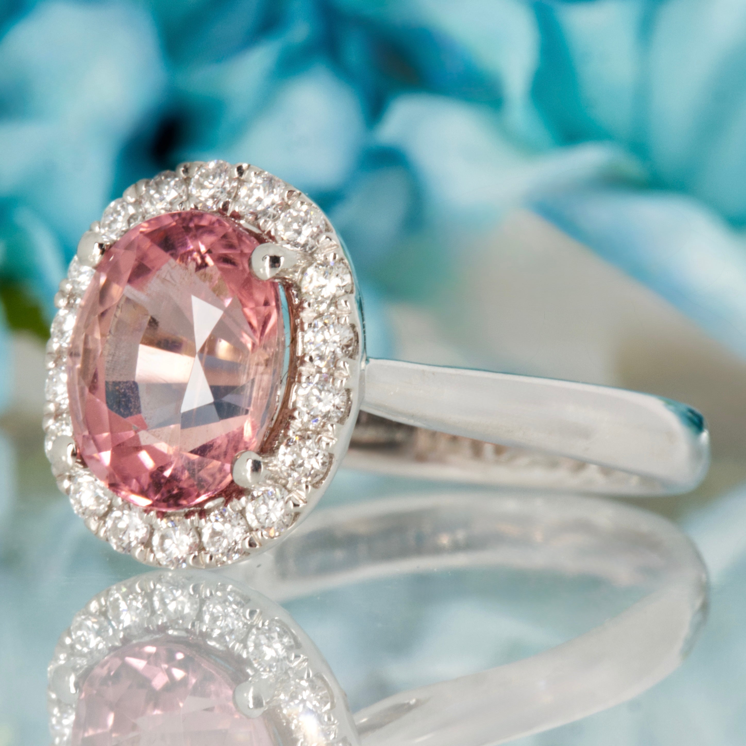 Platinum Oval Cut Pink Tourmaline & Round Brilliant Cut Diamond Halo Cluster Ring