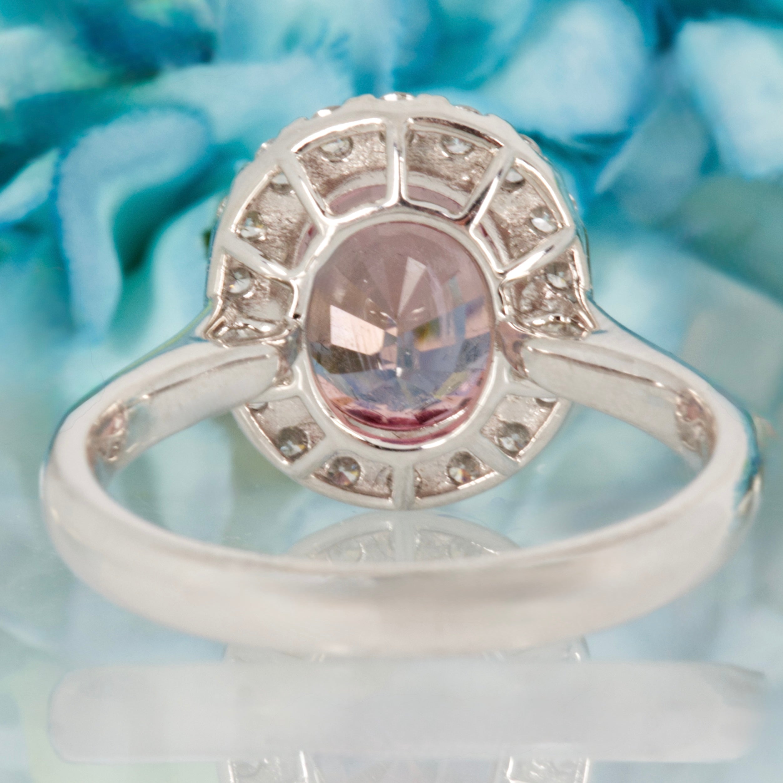 Platinum Oval Cut Pink Tourmaline & Round Brilliant Cut Diamond Halo Cluster Ring