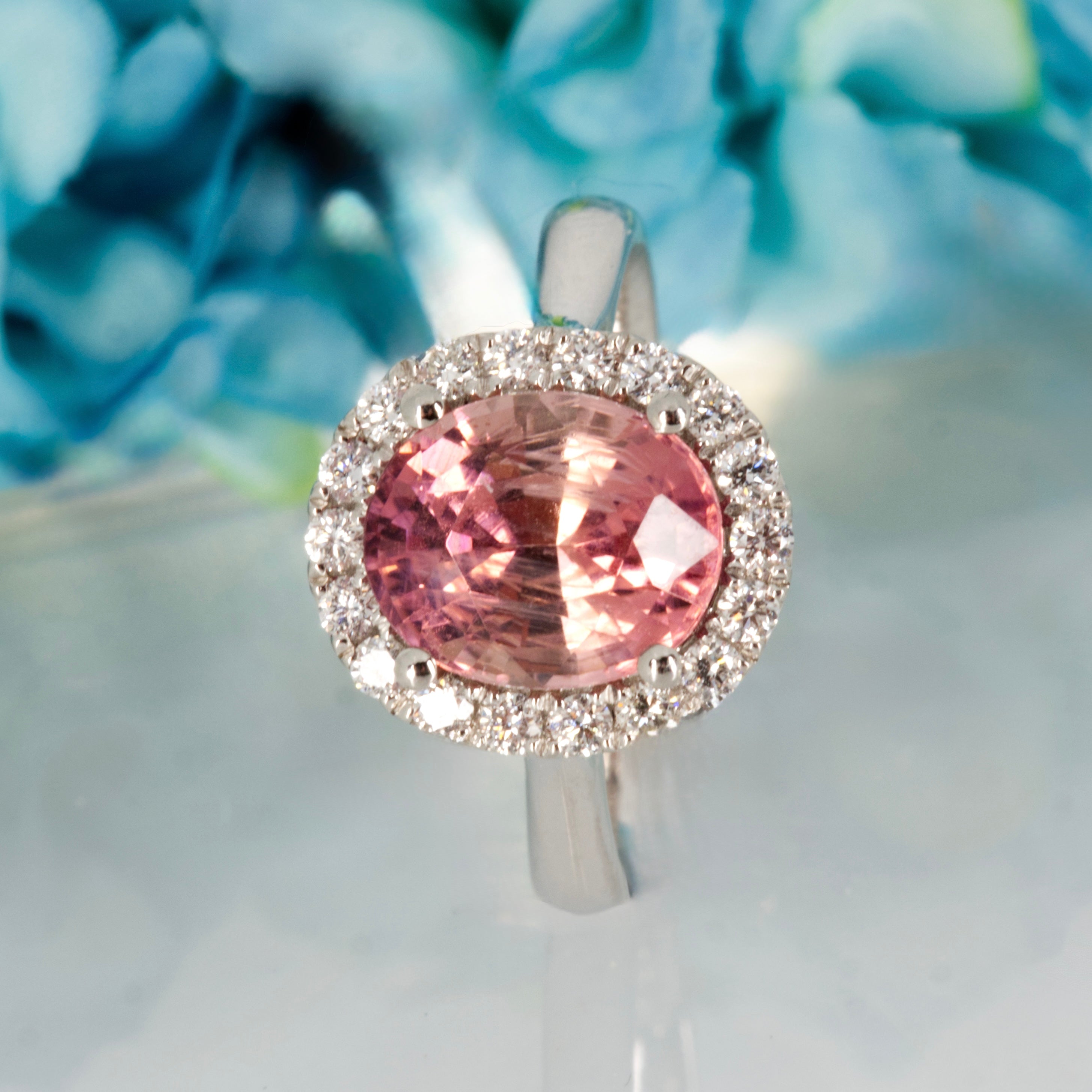 Platinum Oval Cut Pink Tourmaline & Round Brilliant Cut Diamond Halo Cluster Ring
