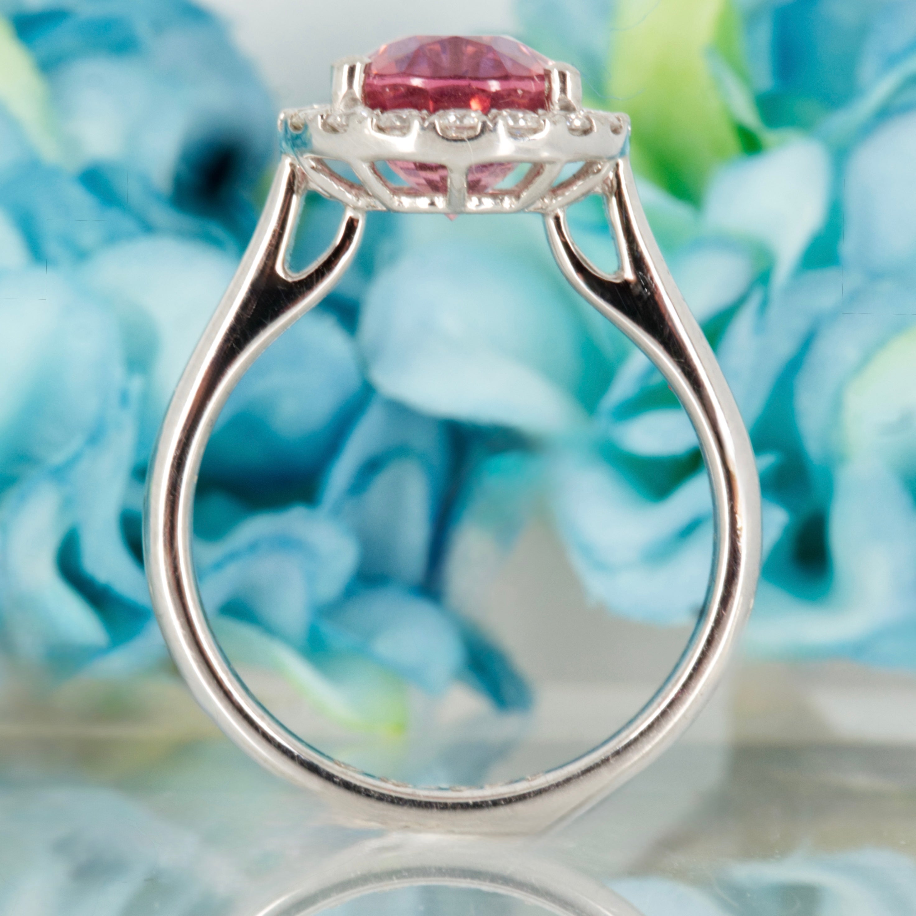 Platinum Oval Cut Pink Tourmaline & Round Brilliant Cut Diamond Halo Cluster Ring