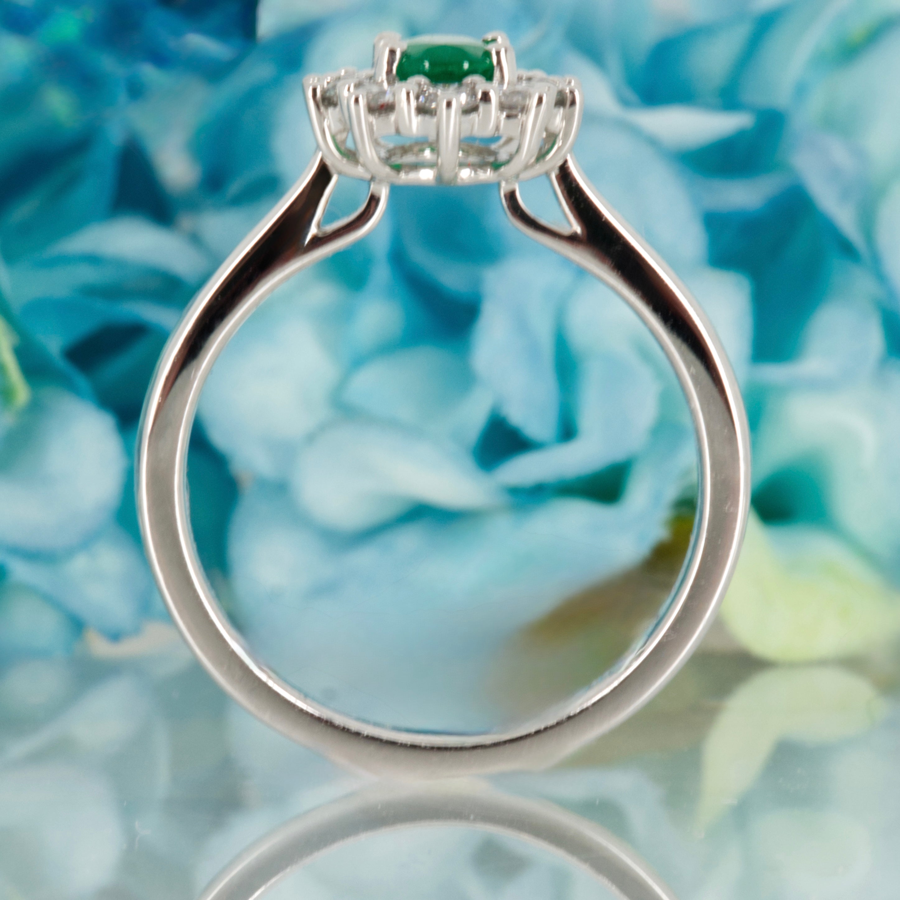 Platinum Oval Cut Emerald & Round Brilliant Cut Diamond Cluster Ring