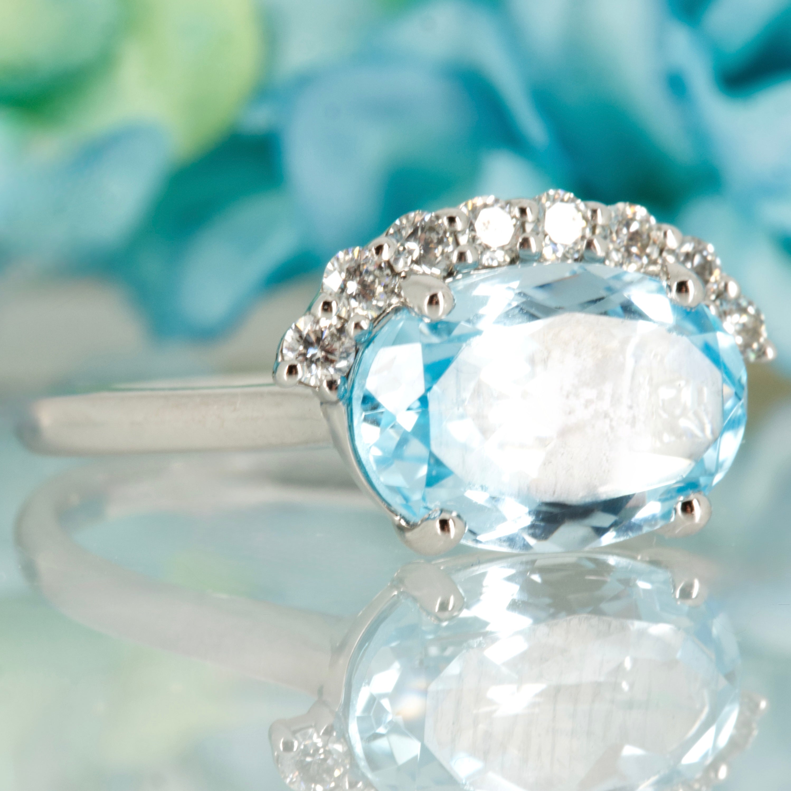 9ct White Gold Oval Cut Blue Topaz & Round Brilliant Cut Diamond Dress Ring