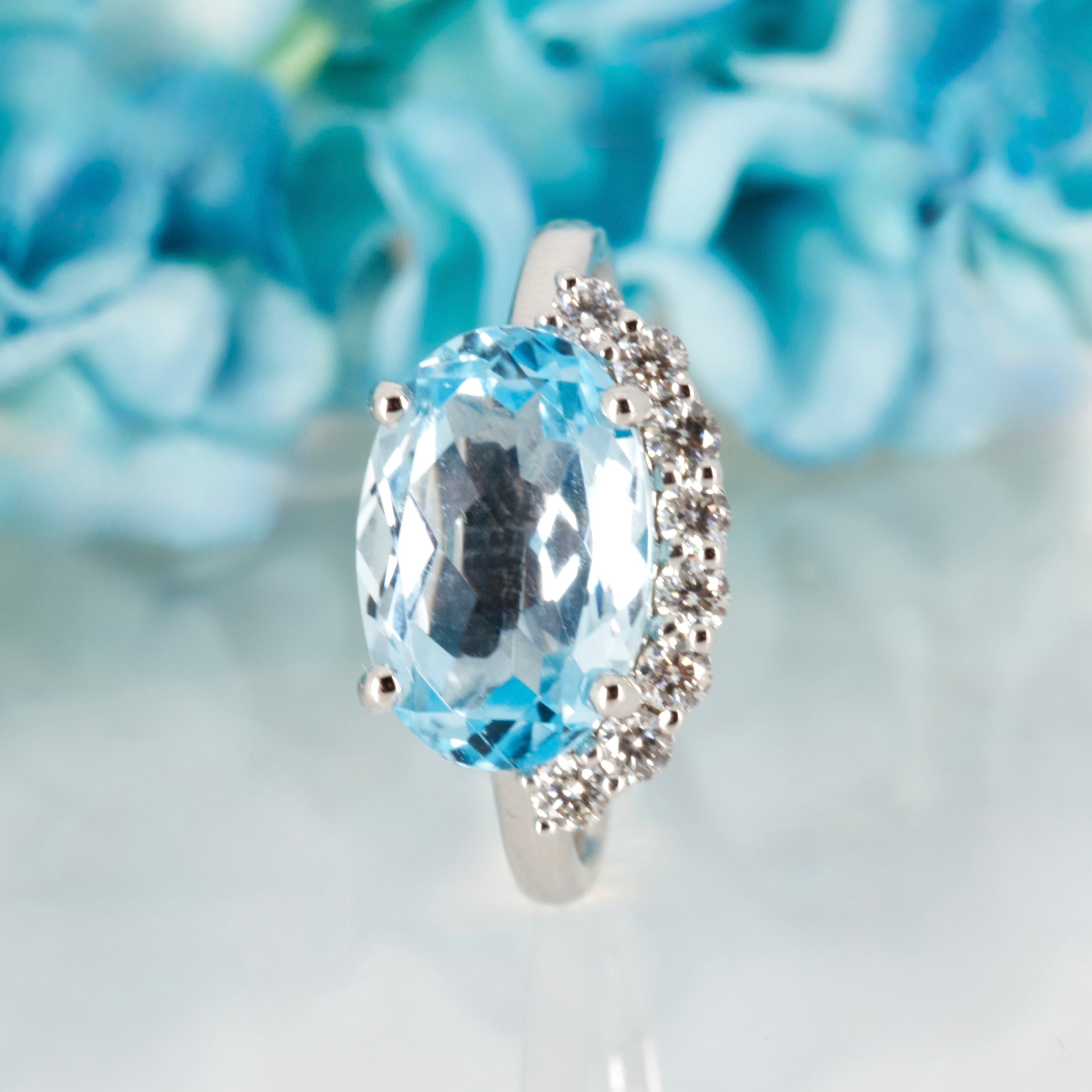 9ct White Gold Oval Cut Blue Topaz & Round Brilliant Cut Diamond Dress Ring