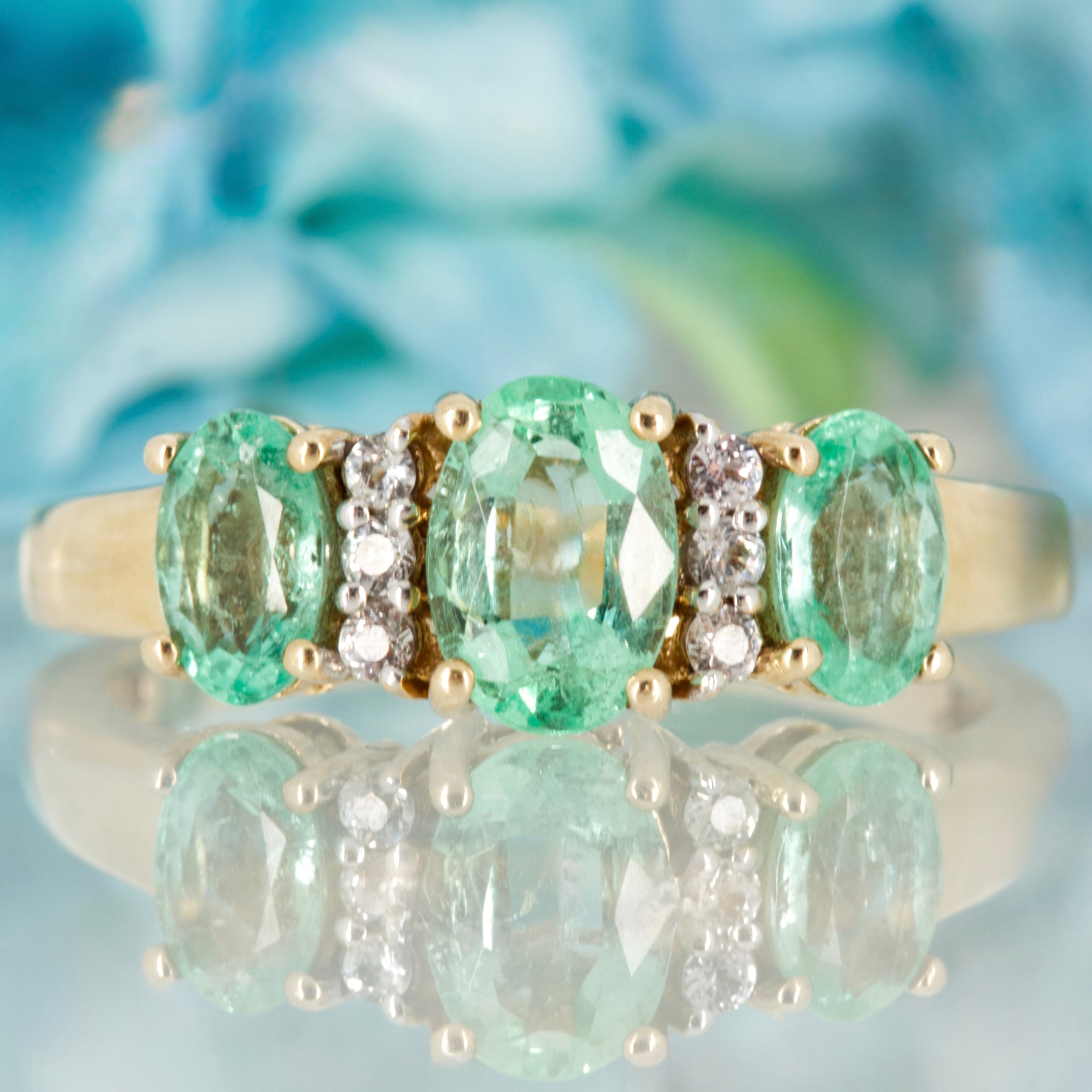 Pre-Loved 9ct Yellow Gold Oval Cut Emerald & Round Cut White Stone Dress Ring