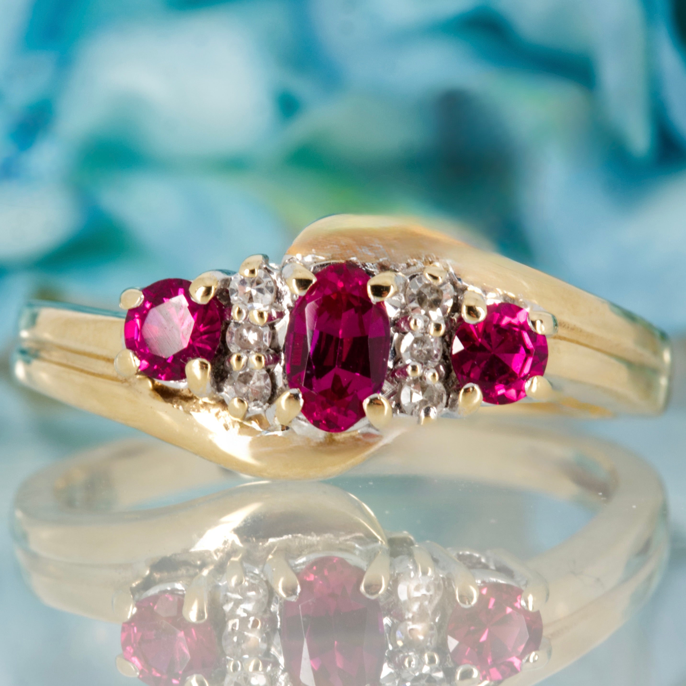 Pre-Loved 9ct Yellow Gold Oval & Round Cut Ruby & Round Brilliant Cut Diamond Dress Ring
