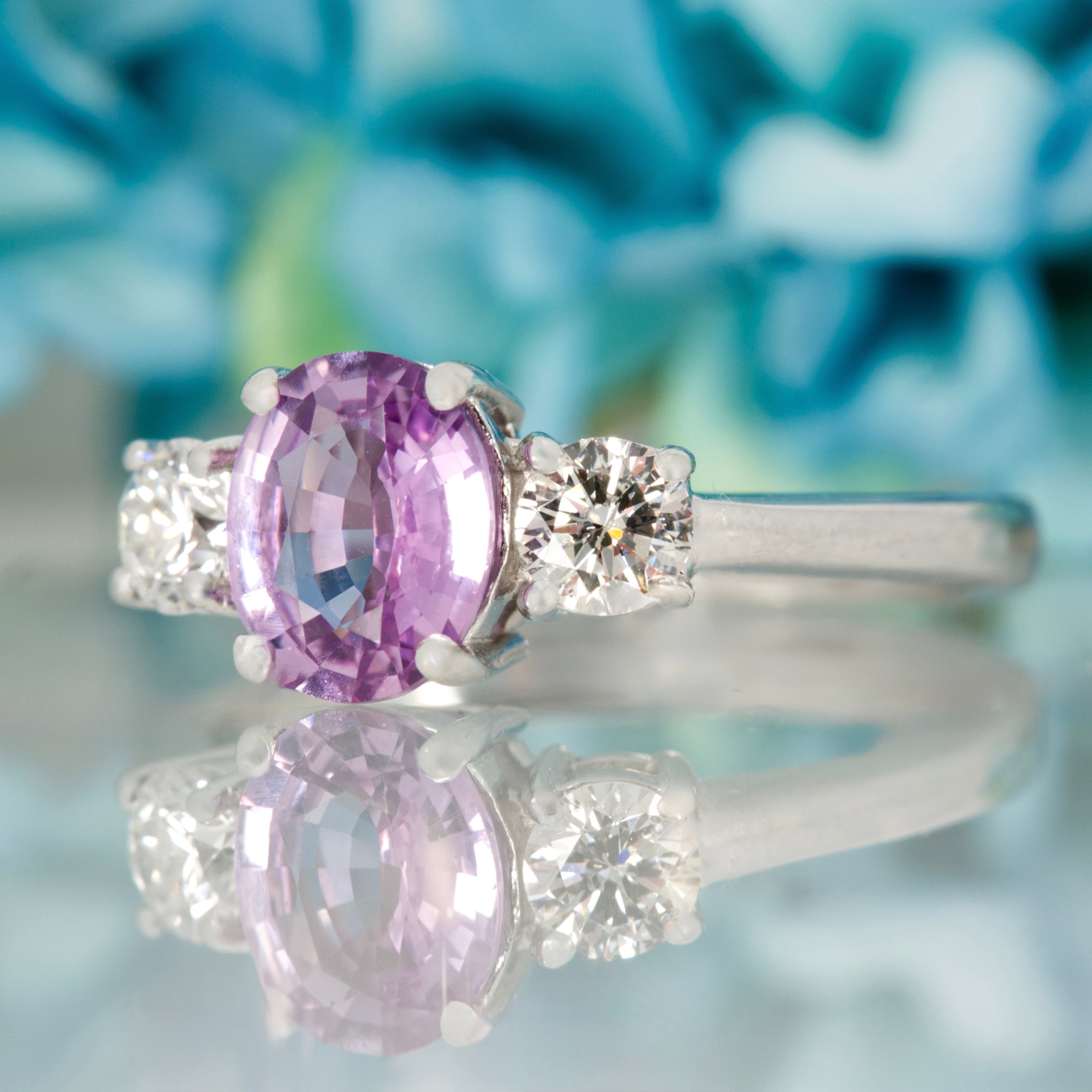 Pre-Loved 18ct White Gold Oval Cut Lilac Sapphire & Round Brilliant Cut Diamond Trilogy Ring