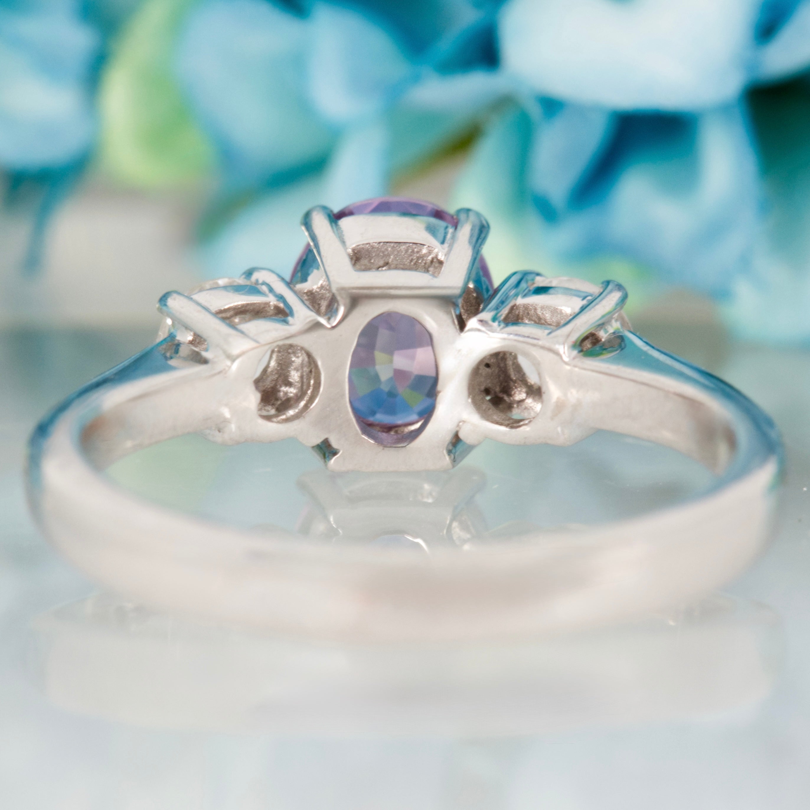 Pre-Loved 18ct White Gold Oval Cut Lilac Sapphire & Round Brilliant Cut Diamond Trilogy Ring