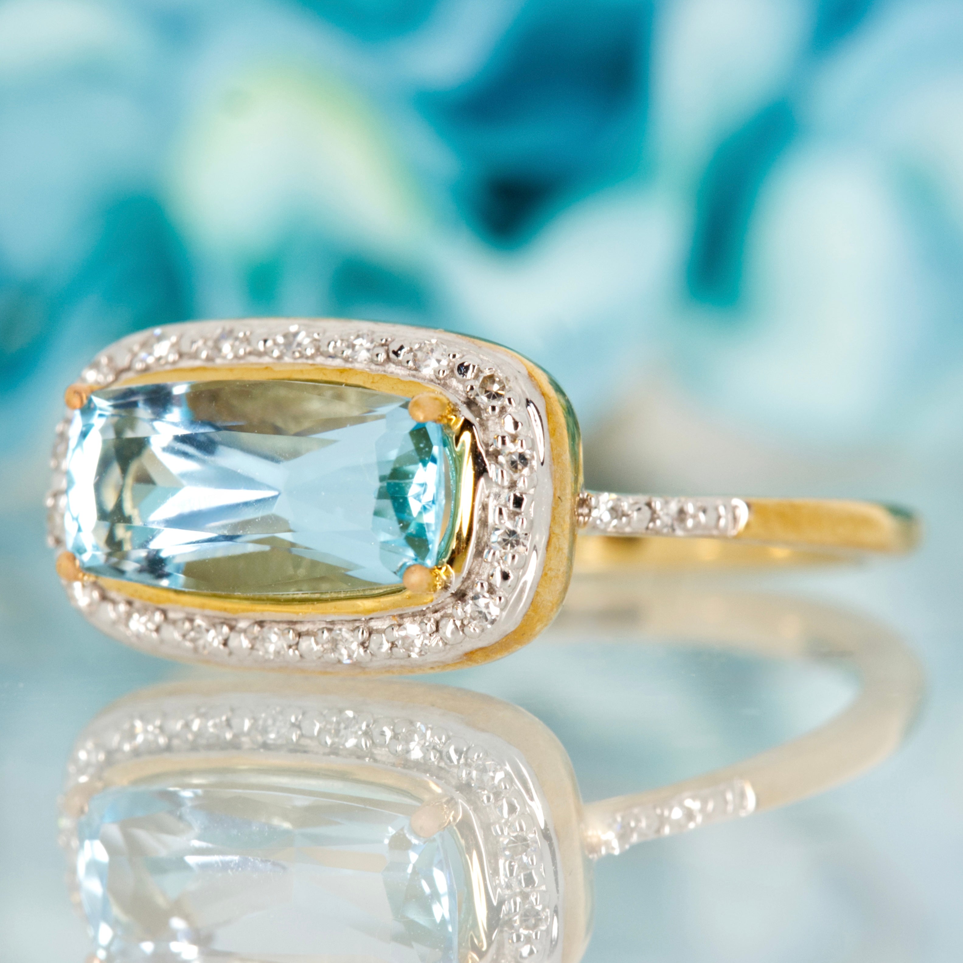 9ct Yellow Gold Rectangular Cut Blue Topaz & Round Brilliant Cut Diamond Halo Cluster Ring