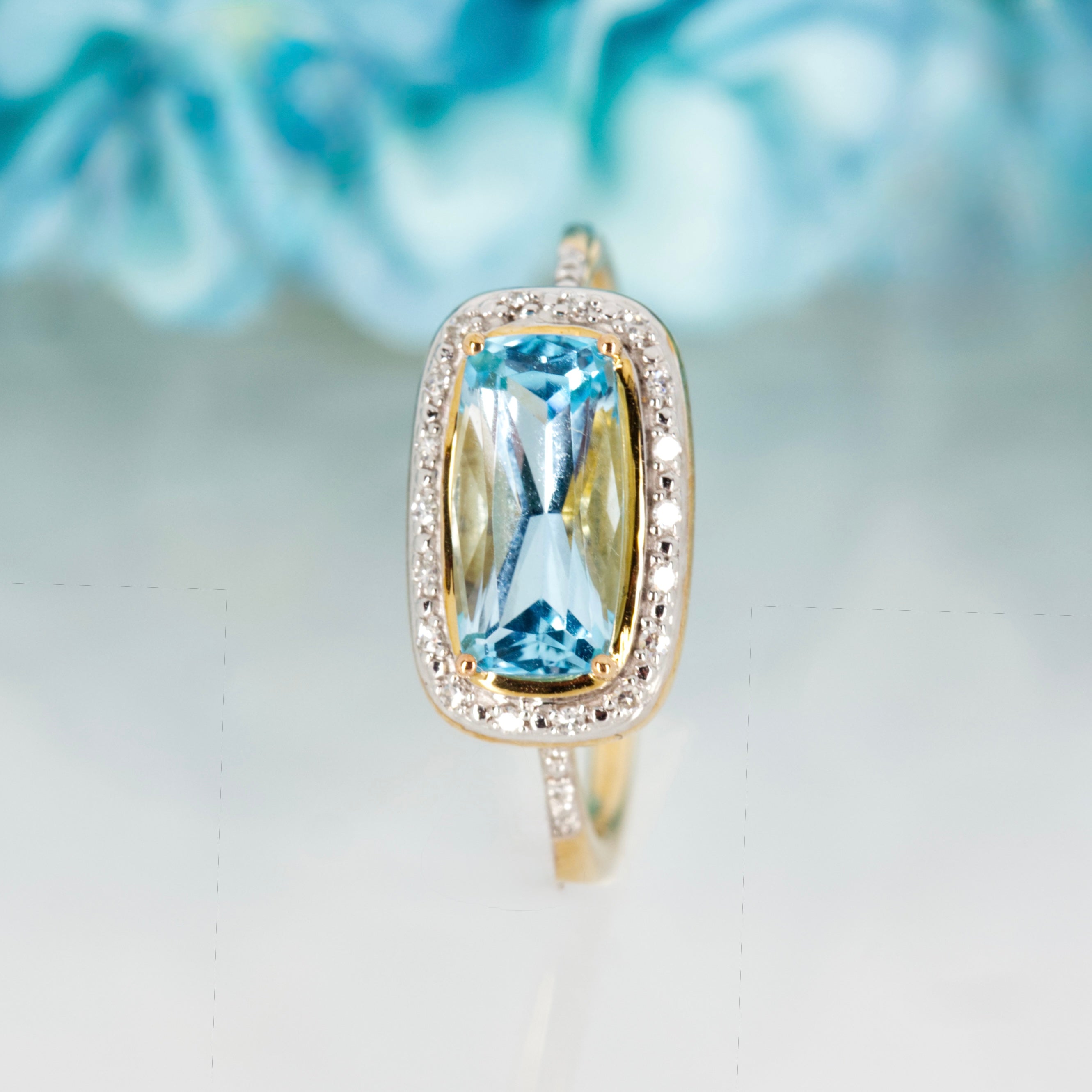 9ct Yellow Gold Rectangular Cut Blue Topaz & Round Brilliant Cut Diamond Halo Cluster Ring