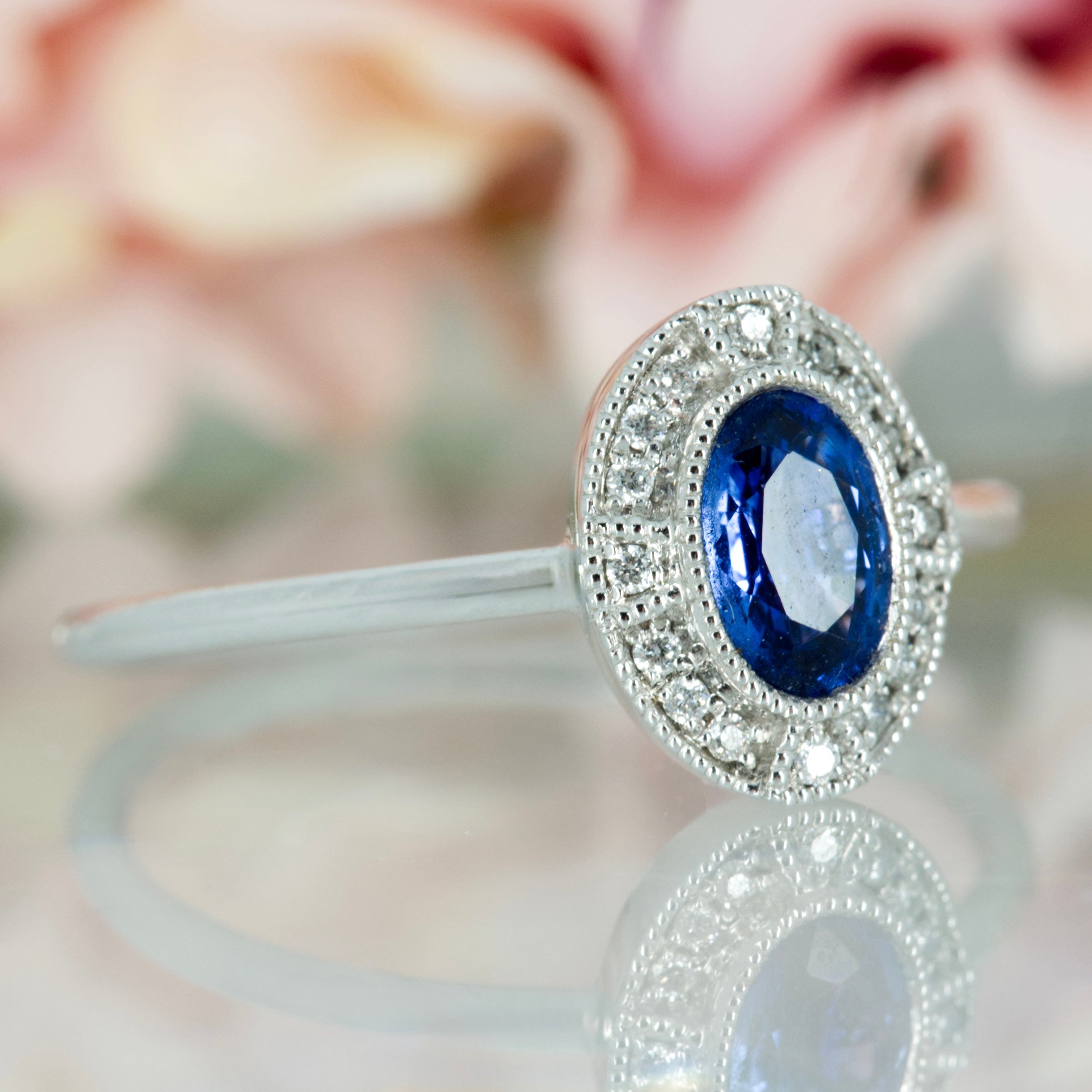 18ct White Gold Oval Cut Sapphire & Round Brilliiant Cut Diamond Halo Cluster Ring
