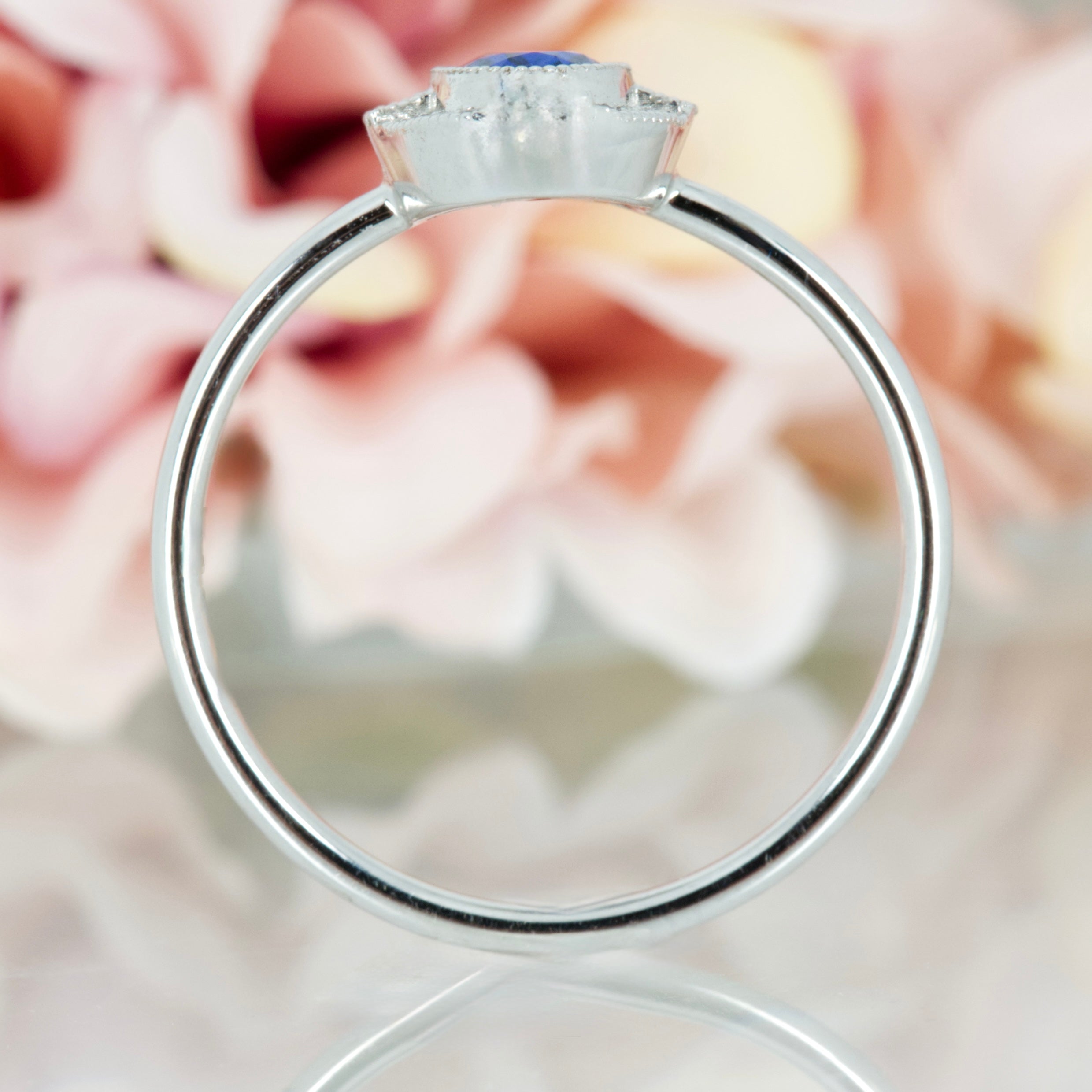 18ct White Gold Oval Cut Sapphire & Round Brilliiant Cut Diamond Halo Cluster Ring