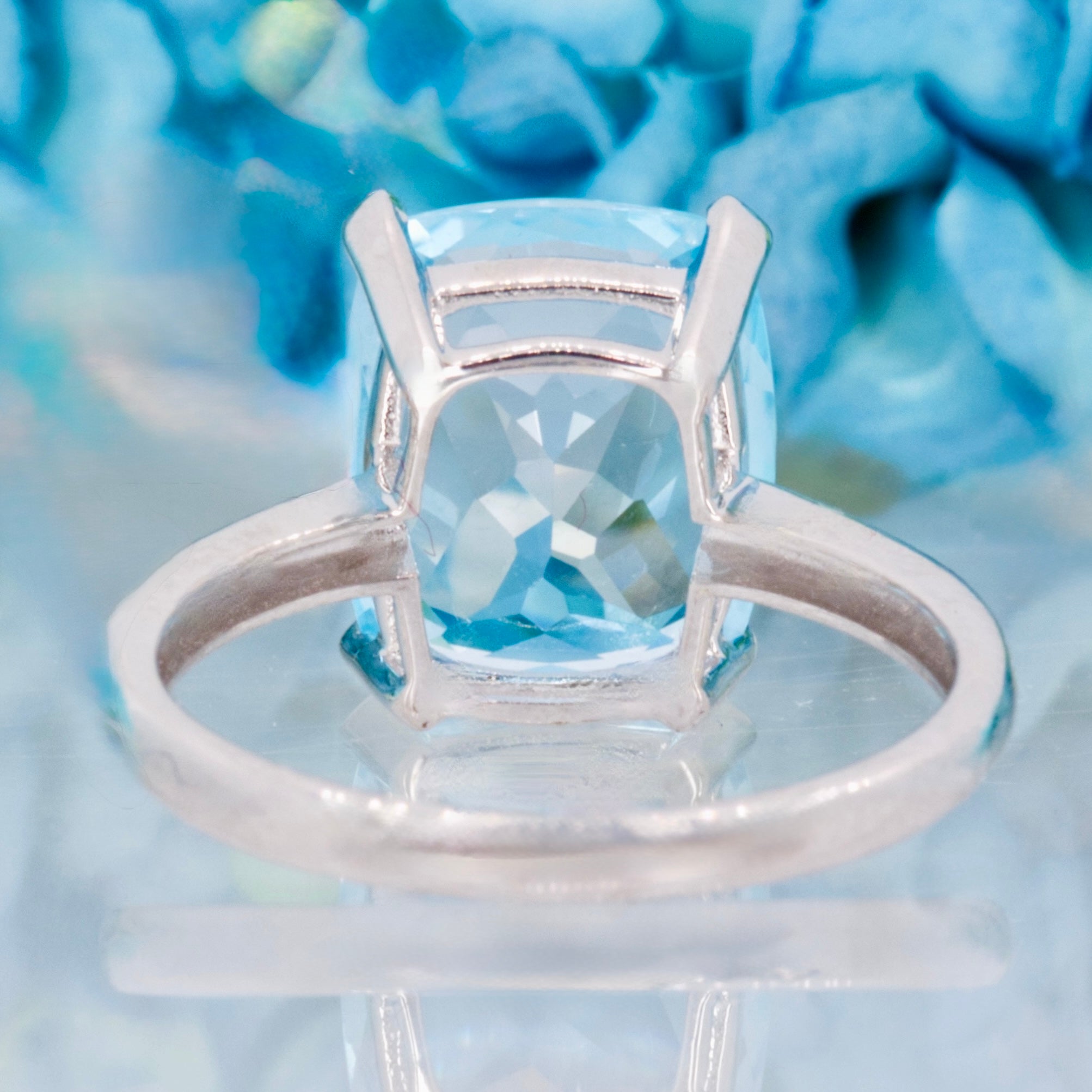9ct White Gold Elongated Cushion Cut Blue Topaz & Round Brilliant Cut Diamond Ring