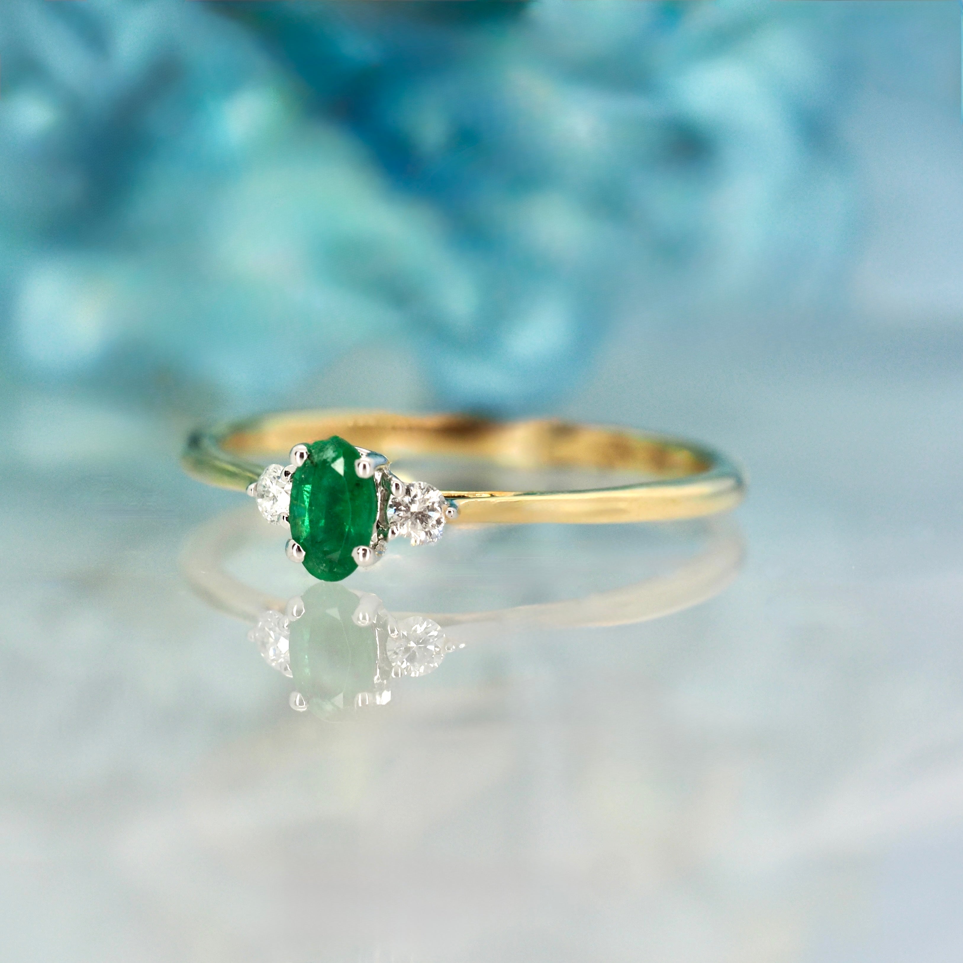 9ct Yellow Gold Oval Cut Emerald & Round Brilliant Cut Diamond Trilogy Ring