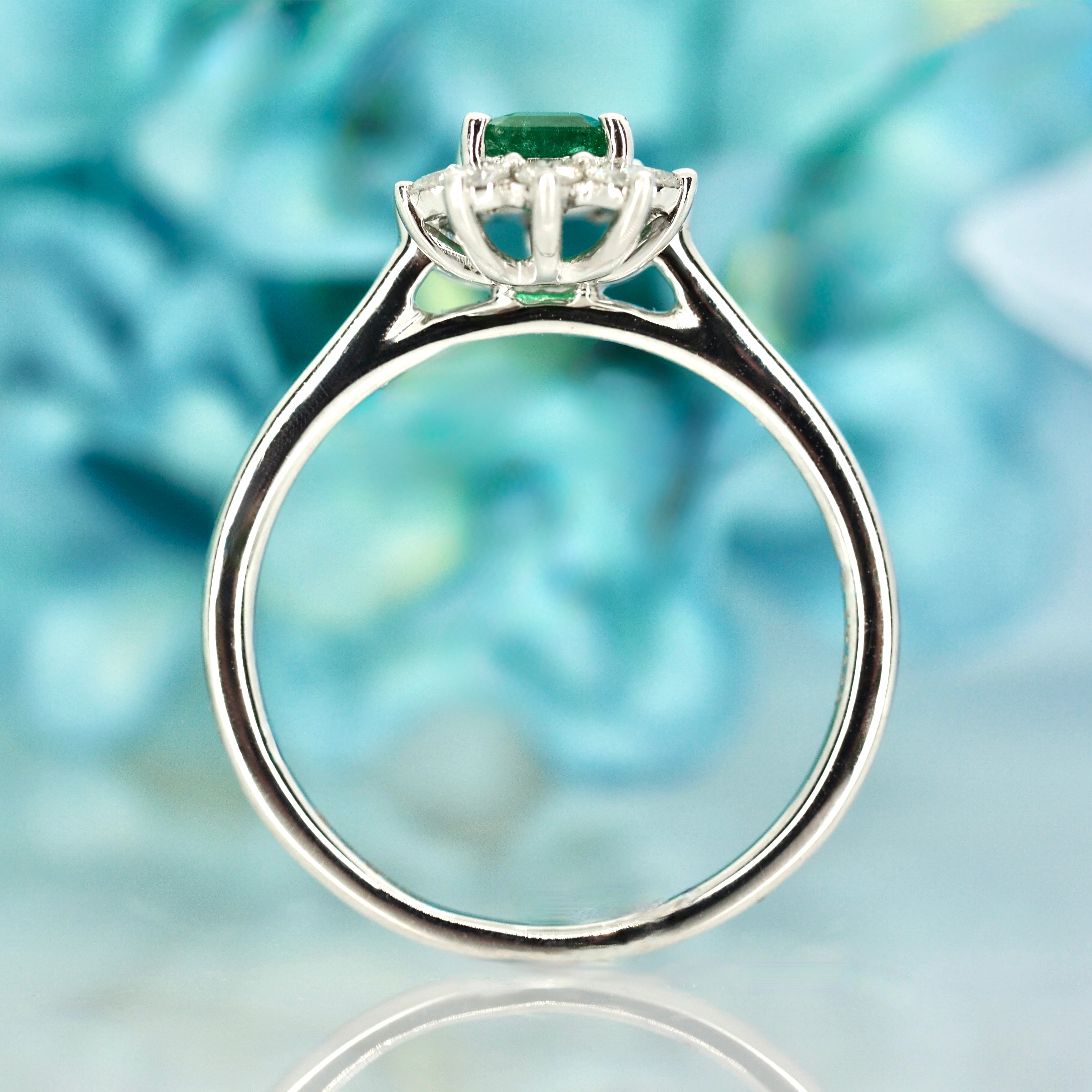 Platinum Rectangular Cut Emerald & Round Brilliant Cut Diamond Cluster Ring