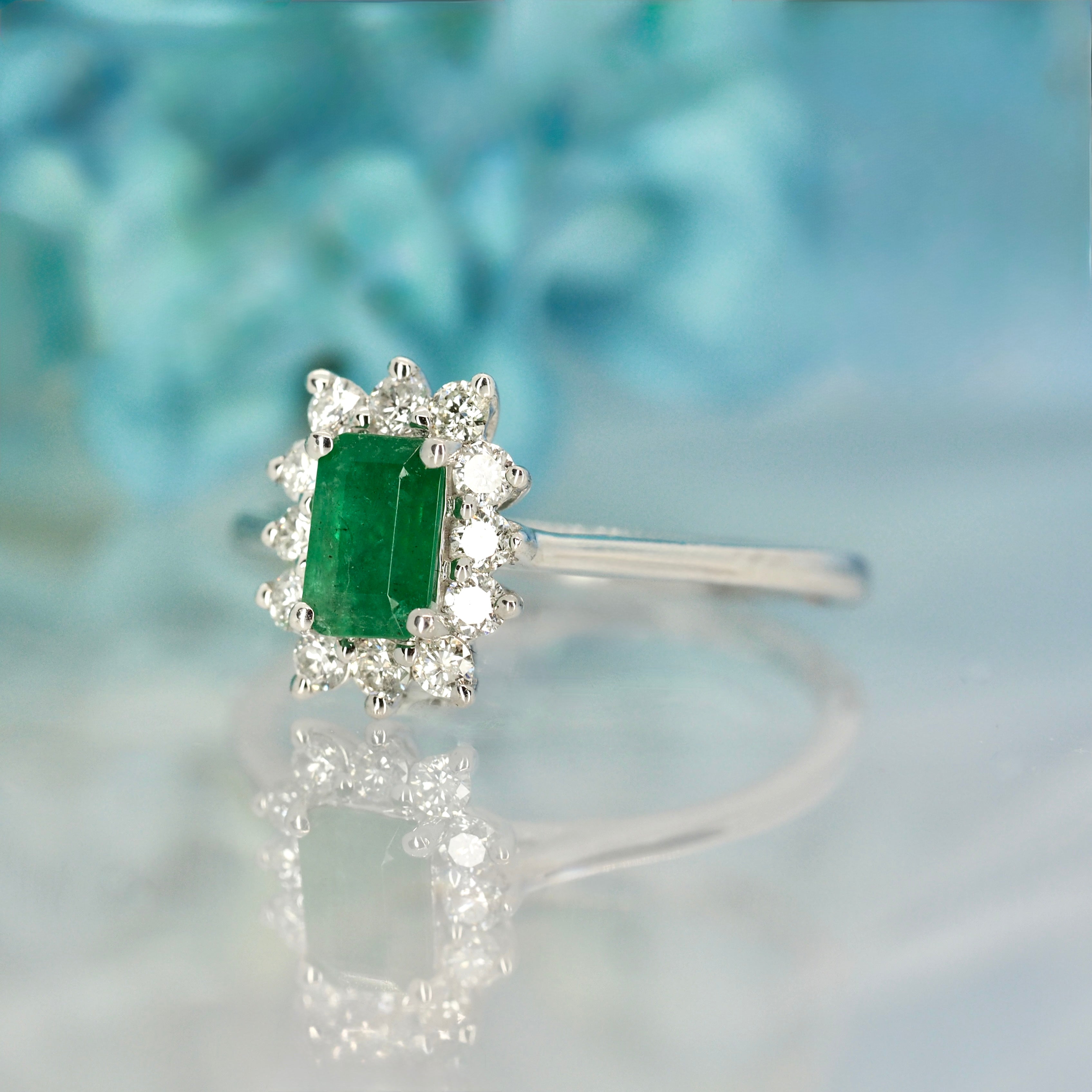 Platinum Rectangular Cut Emerald & Round Brilliant Cut Diamond Cluster Ring