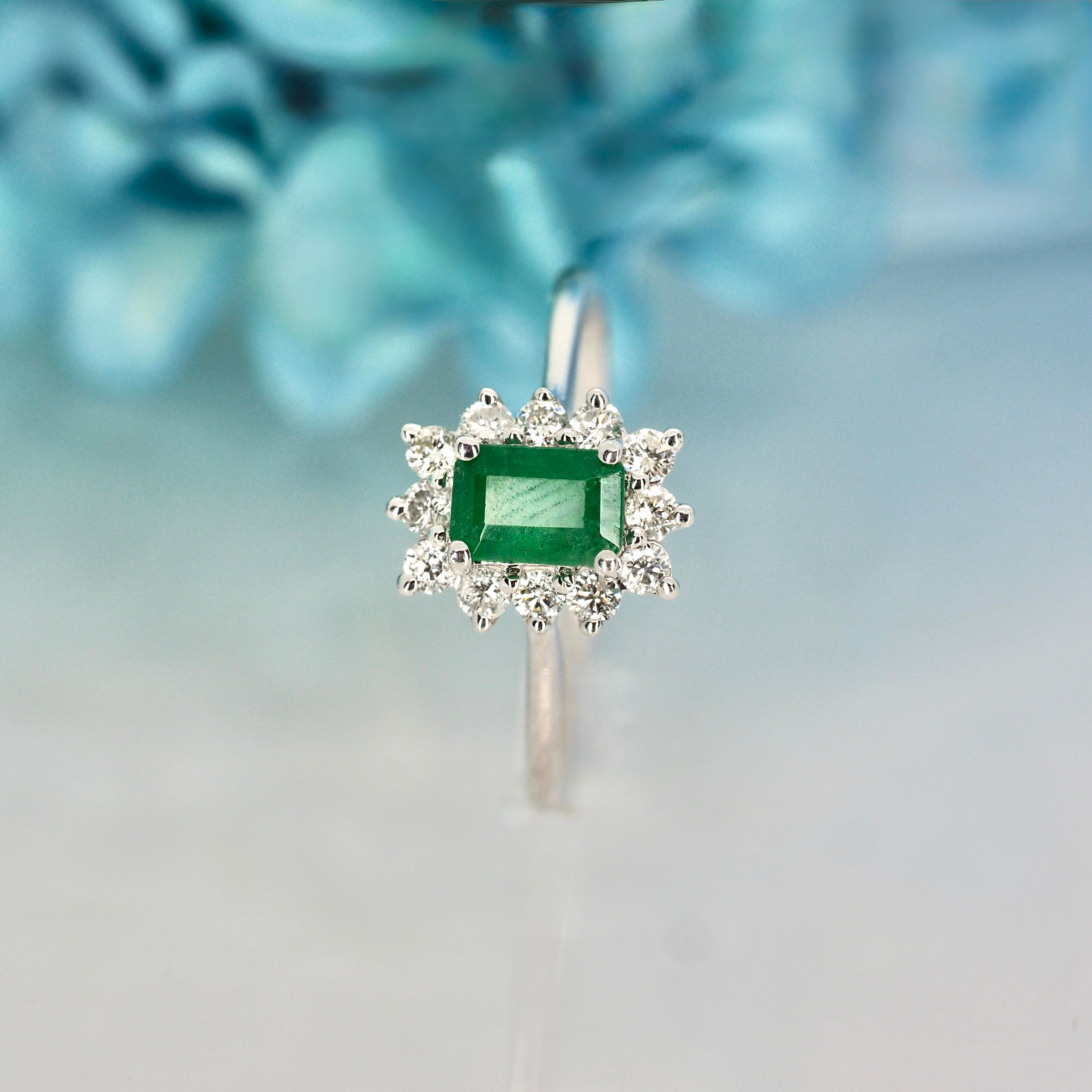 Platinum Rectangular Cut Emerald & Round Brilliant Cut Diamond Cluster Ring